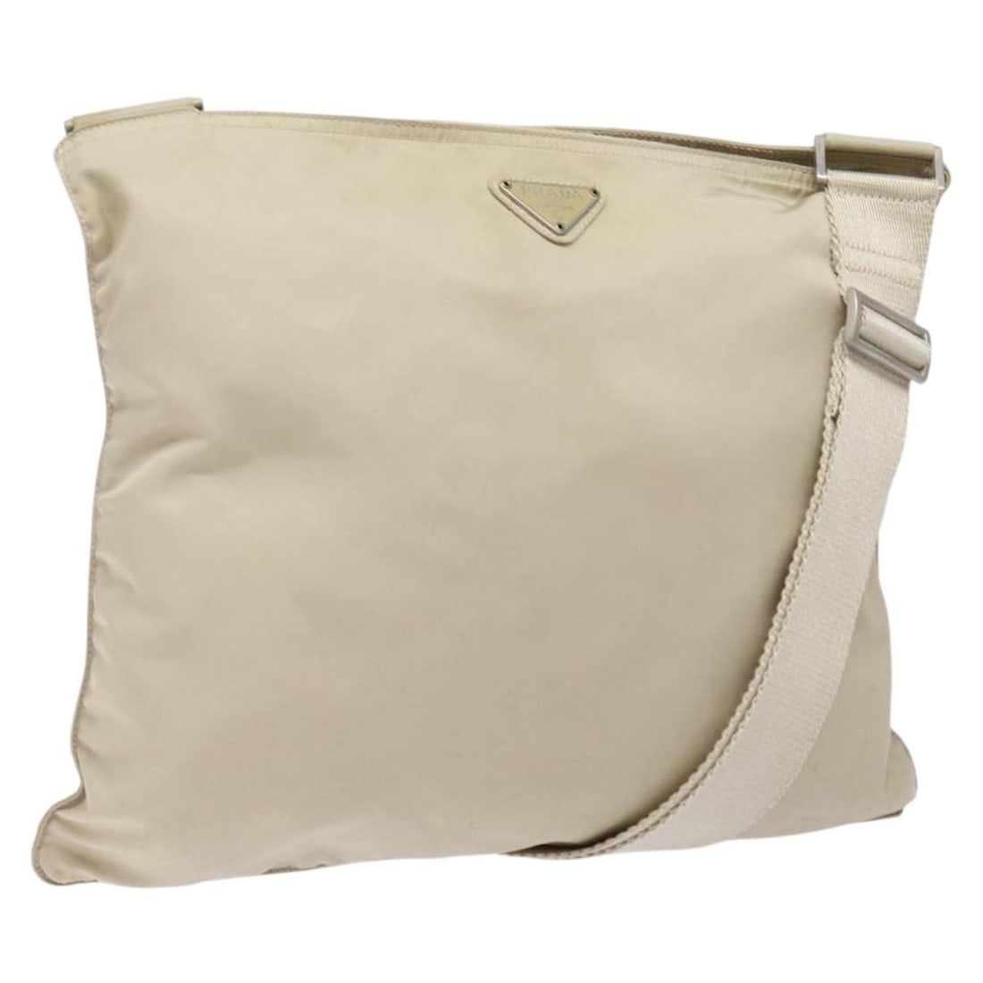 PRADA Beige Nylon Shoulder Bag Made in Italy Adjustable Strap: PRADA Beige Nylon Shoulder Bag Made in Italy Adjustable Strap This authentic PRADA shoulder bag combines style and functionality, crafted from durable beige nylon. The sleek design measures approximat