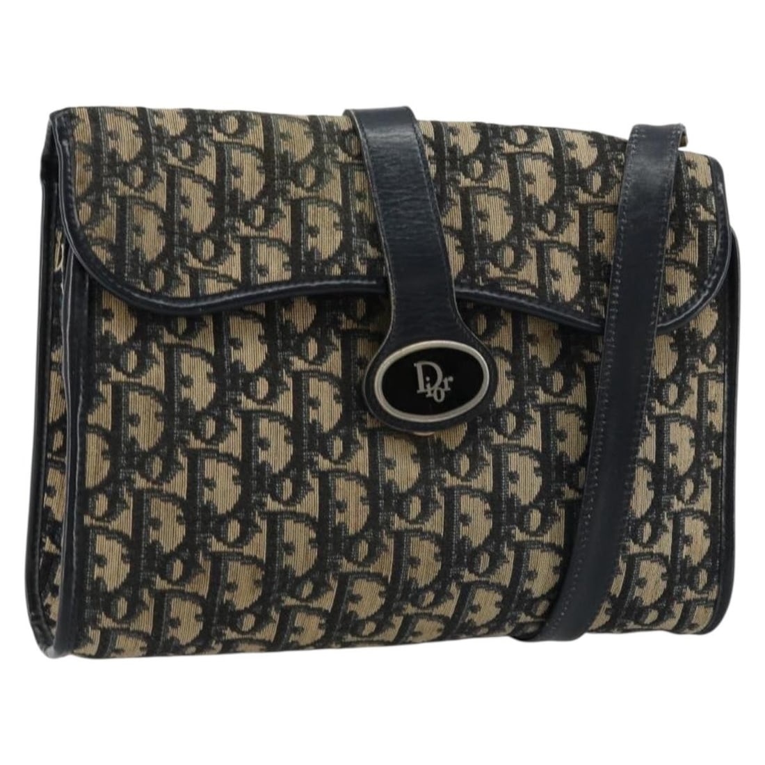 Christian Dior Navy Trotter Canvas Shoulder Bag Made in France: Christian Dior Navy Trotter Canvas Shoulder Bag Made in France This Christian Dior Trotter Canvas Shoulder Bag in navy is a shoulder bag made in France. It features Trotter canvas construction and com
