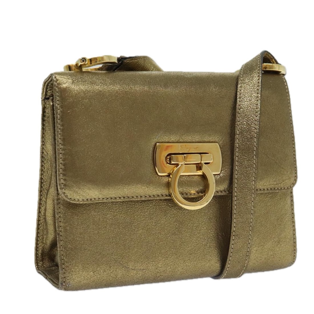Gancini Leather Shoulder Bag in Gold by Salvatore Ferragamo: Gancini Leather Shoulder Bag in Gold by Salvatore Ferragamo This Salvatore Ferragamo Gancini shoulder bag is crafted from gold leather and features the iconic Gancini motif. Designed for women, the ba