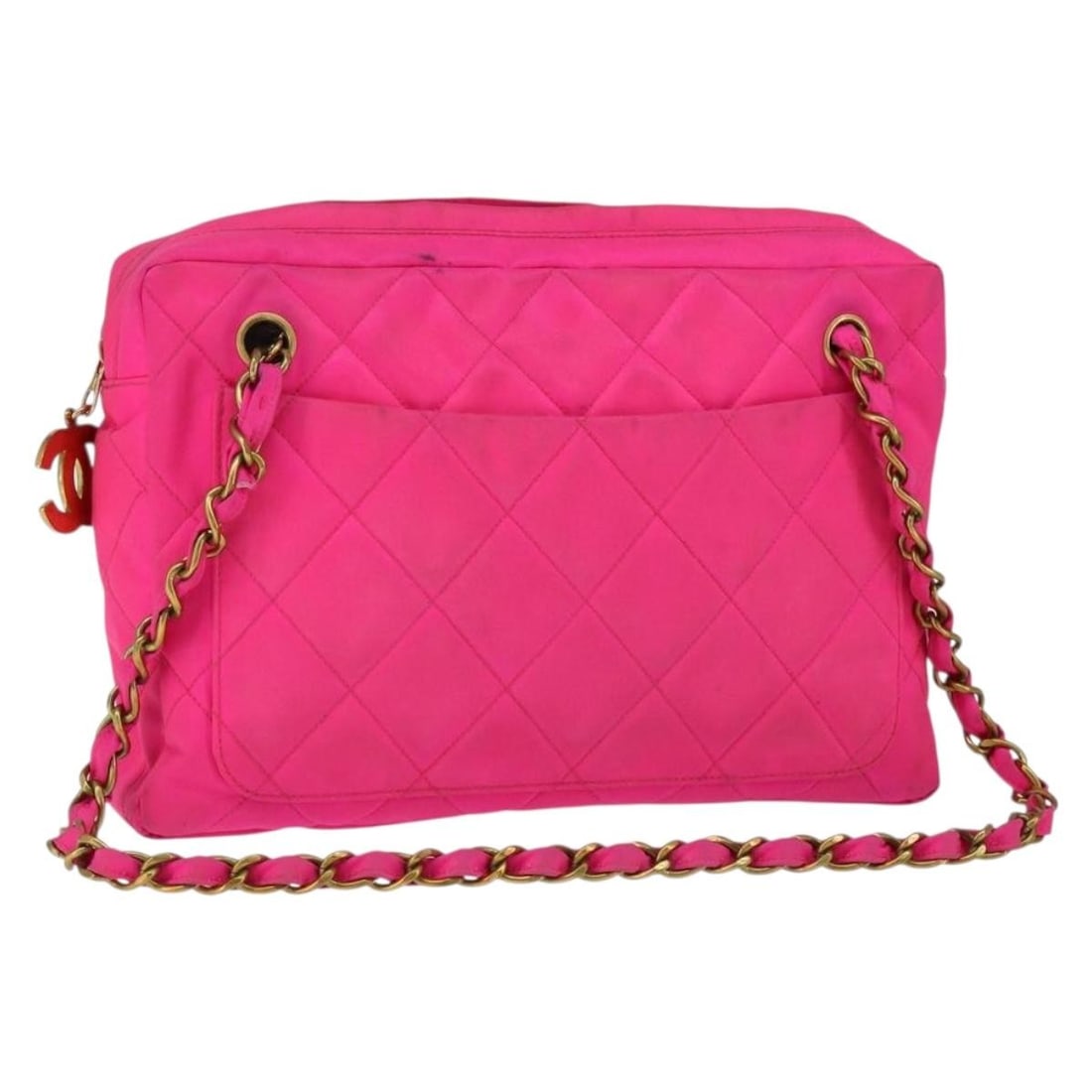CHANEL Pink Nylon Matelasse CC Shoulder Bag Gold Chain: CHANEL Pink Nylon Matelasse CC Shoulder Bag Gold Chain This CHANEL Matelasse chain shoulder bag is crafted from pink and gold nylon, offering a stylish and lightweight design. Made in France, the bag 