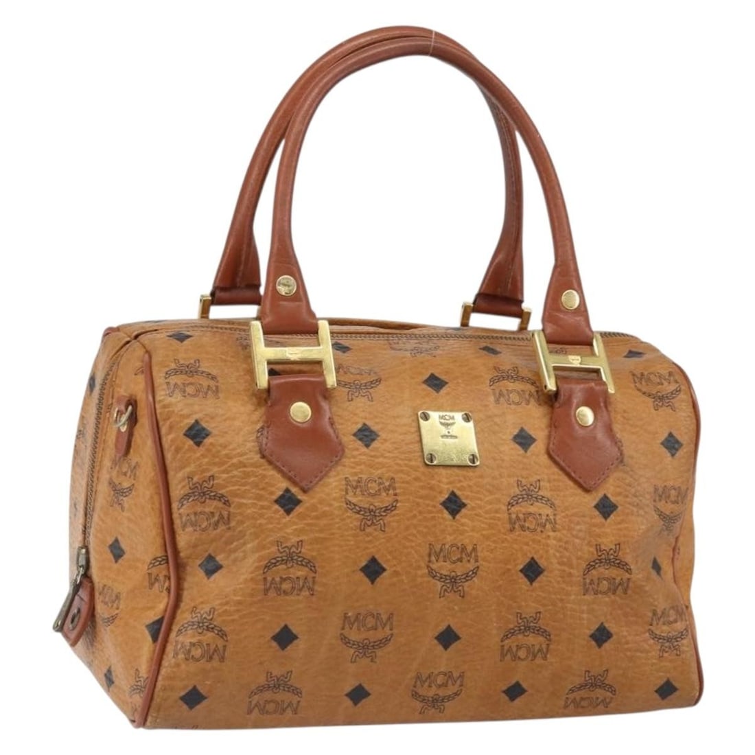 MCM Boston Bag PVC Leather Brown and Gold Germany Handbag: MCM Boston Bag PVC Leather Brown and Gold Germany Handbag This MCM Boston Bag features the iconic Vicetos logogram design in brown and gold PVC leather. The bag is heavily used and shows signs of wear