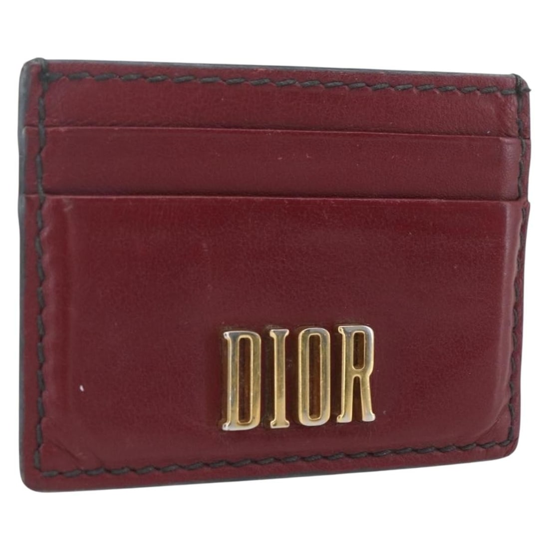Red Leather Card Holder by Christian Dior Gold Accents Made in Italy: Red Leather Card Holder by Christian Dior Gold Accents Made in Italy This Christian Dior card case is crafted from red leather with gold-tone accents. Made in Italy, it features a compact design ideal
