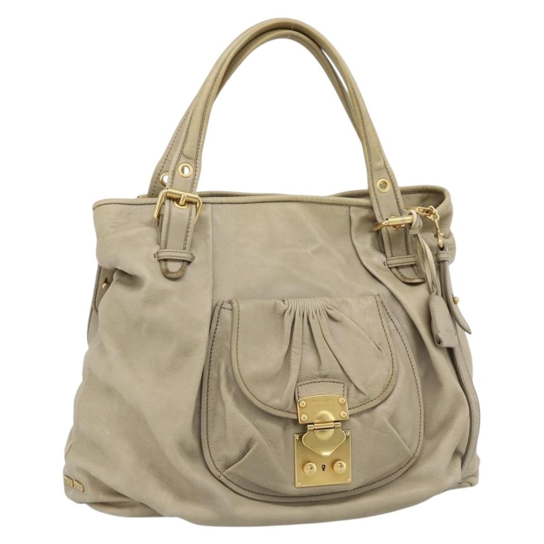 Miu Miu Beige Leather 2way Handbag with Shoulder Strap Key Clochette: Miu Miu Beige Leather 2way Handbag with Shoulder Strap Key Clochette Beige and gold Miu Miu leather handbag in a 2-way style, made in Italy. It comes with a key, clochette, and shoulder strap. The bag