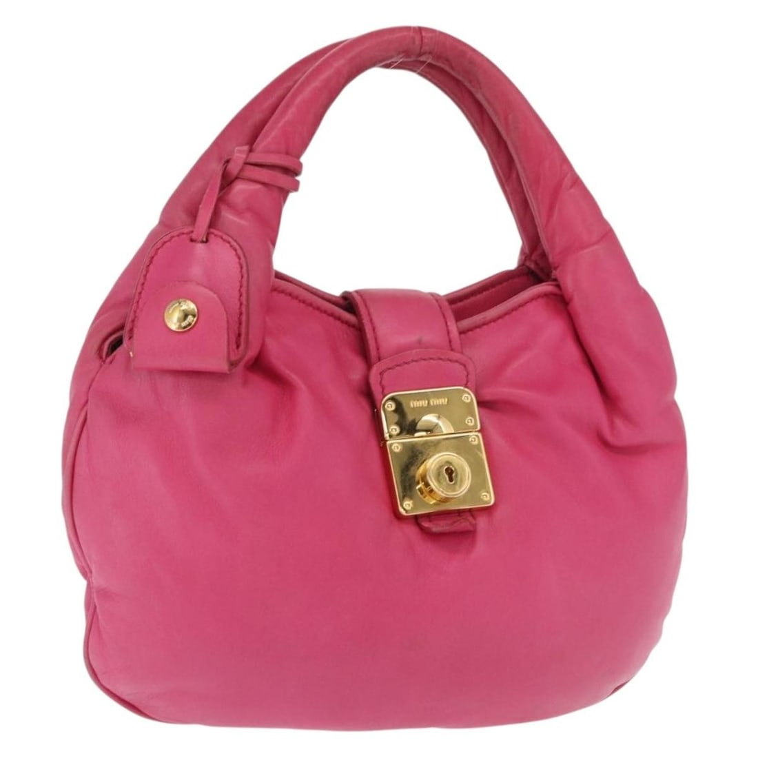Miu Miu Pink Leather Hand Bag with Dust Bag Key Clochette: Miu Miu Pink Leather Hand Bag with Dust Bag Key Clochette Miu Miu hand bag in pink and gold leather, made in Turkey. It comes with a dust bag, one key, and a clochette. The bag is listed in heavily us