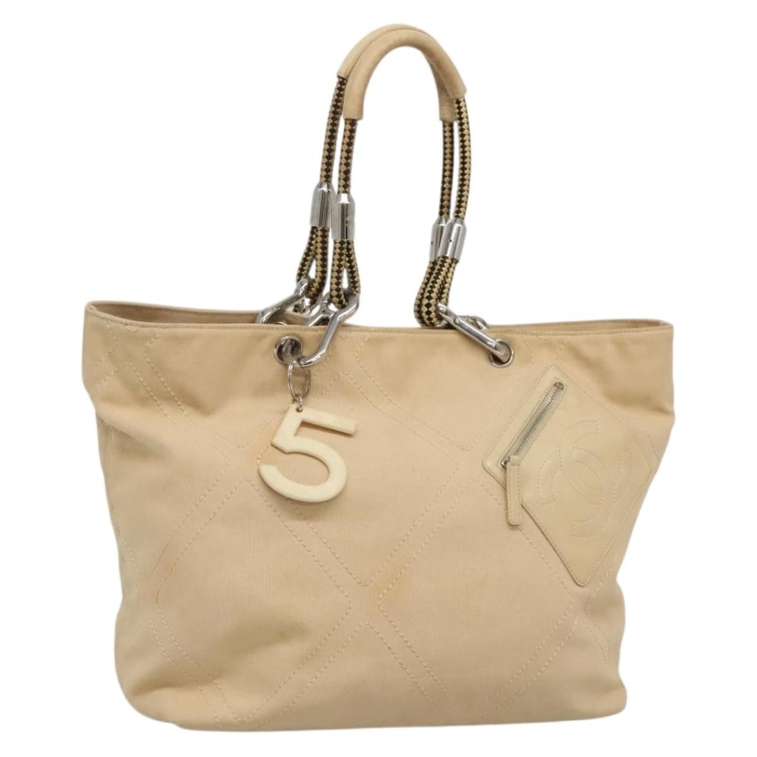 CHANEL Coco Mark Canvas Tote Beige Silver Italy: CHANEL Coco Mark Canvas Tote Beige Silver Italy CHANEL Coco Mark tote bag in beige and silver canvas, made in Italy. This women's tote features a structured silhouette with approximate dimensions of 3