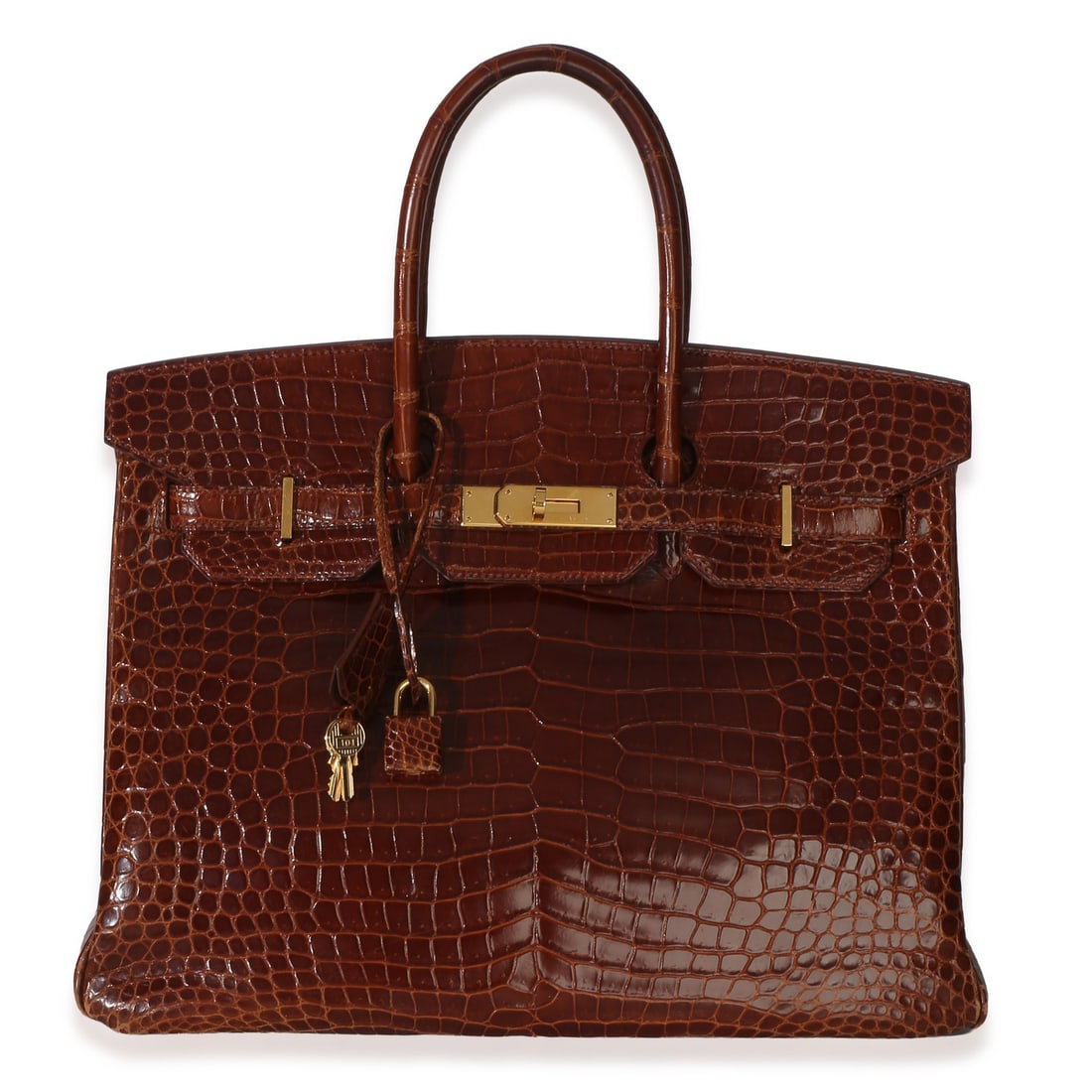 Hermes Birkin 35 Miel Porosus Crocodile Gold Tone Hardware: Hermes Birkin 35 Miel Porosus Crocodile Gold Tone Hardware This Hermes Birkin 35 features luxurious Miel Porosus crocodile leather in a rich brown hue, complemented by gold-tone hardware. The top hand