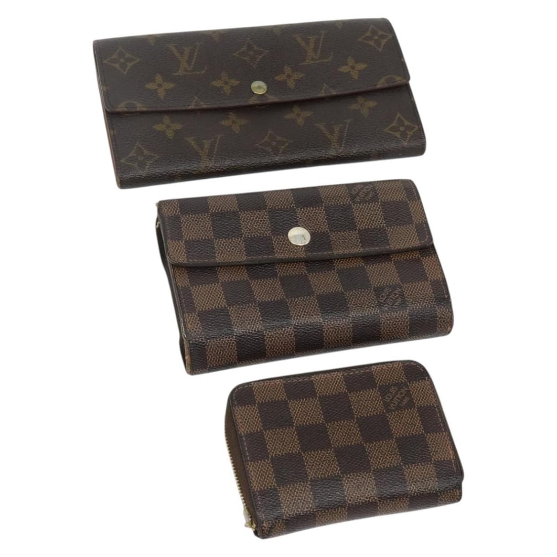 Set of 3 Louis Vuitton Monogram Canvas Wallets Damier Ebene: Set of 3 Louis Vuitton Monogram Canvas Wallets Damier Ebene A Louis Vuitton monogram canvas wallet set offered in heavily used condition. The set includes the item shown in the photo only; no item box
