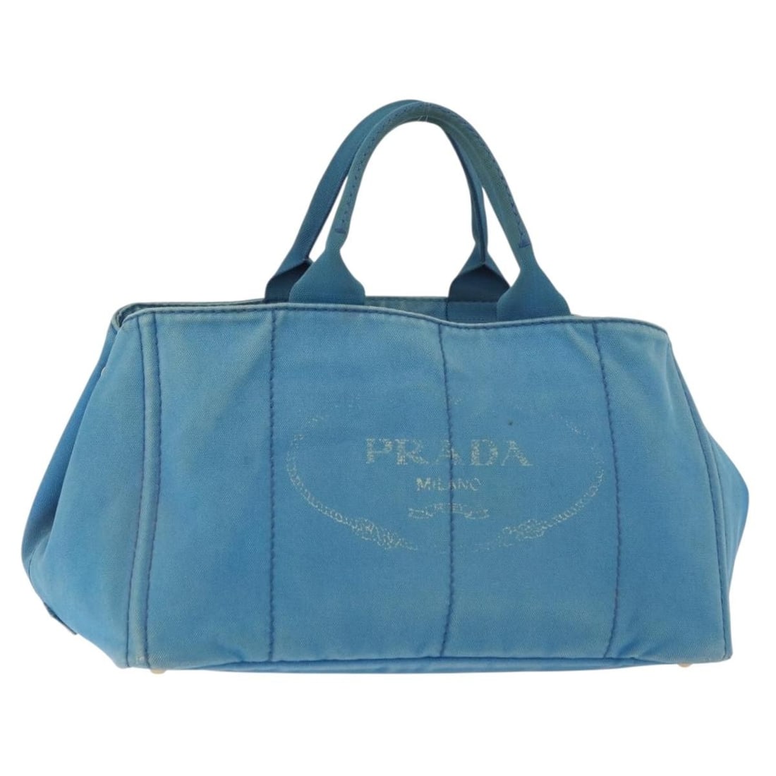 Prada Canapa MM canvas tote in light blue and gold: Prada Canapa MM canvas tote in light blue and gold This PRADA Canapa MM handbag is crafted from light blue canvas with gold-tone accents. Designed for women, it features a structured silhouette with d