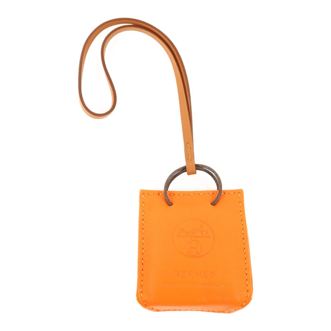 Hermes Sac Orange Milo Bag Charm Lambskin Leather: Hermes Sac Orange Milo Bag Charm Lambskin Leather A Hermes Sac bag charm in orange, crafted from lambskin (sheep leather), calfskin (cowhide), and Agneau Milo leather. It comes with a storage box and 