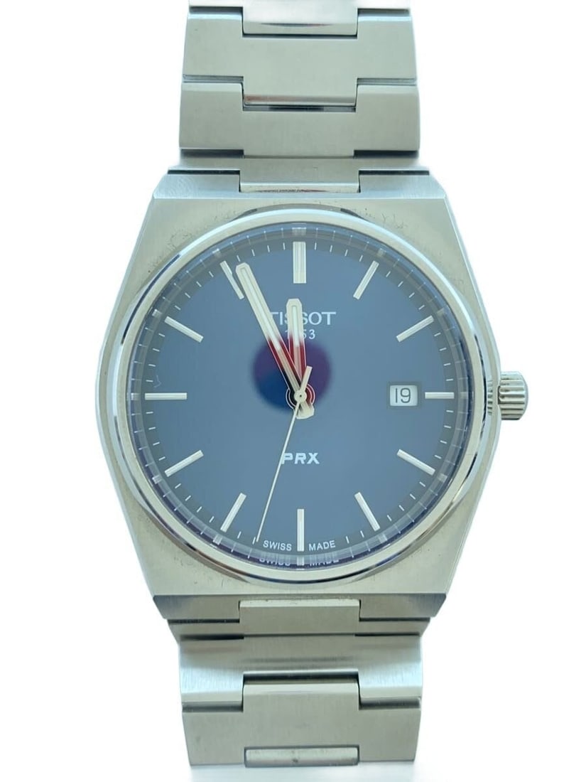 Tissot PRX Navy Stainless Steel Quartz Men's Wristwatch: Tissot PRX Navy Stainless Steel Quartz Men's Wristwatch This TISSOT PRX Quartz Analog wristwatch is crafted for men and features a stainless steel construction with a navy-colored dial. Made in Switze