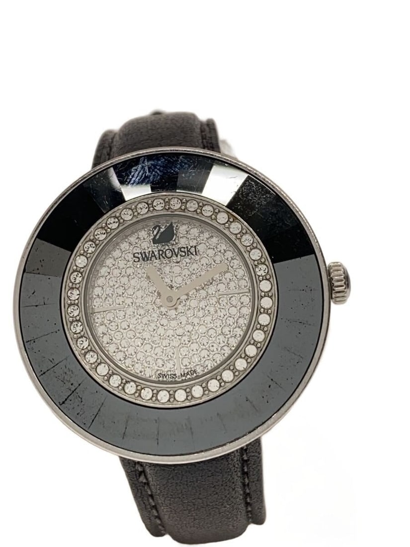 Swarovski Octia silver leather quartz wristwatch women: Swarovski Octia silver leather quartz wristwatch women This Swarovski Octia Dressy Quartz women's wristwatch features a silver-tone case paired with a leather band. Made in Switzerland, it displays a 