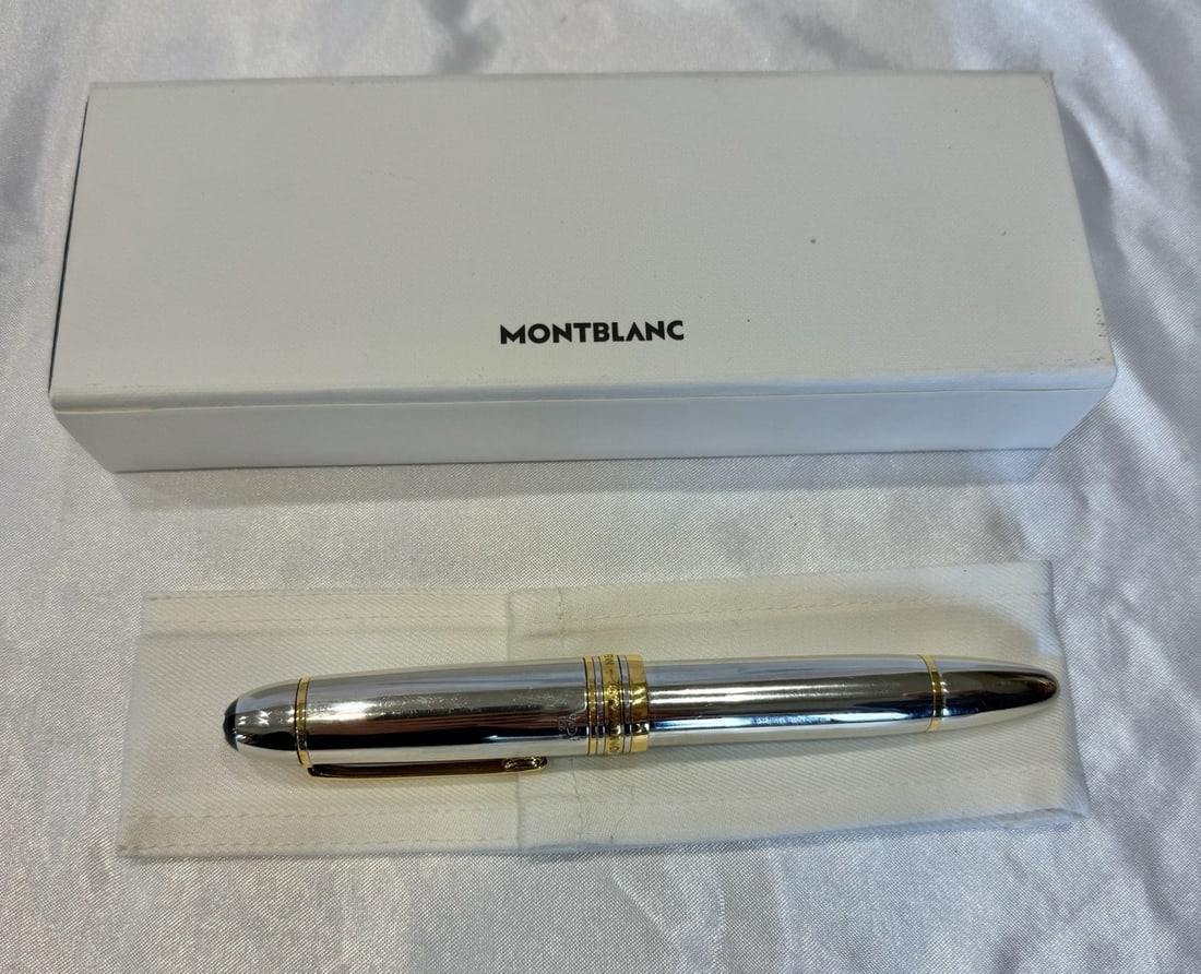 Montblanc Platinum 18K Gold Fountain Pen Model M12149 with Certificate: Montblanc Platinum 18K Gold Fountain Pen Model M12149 with Certificate Discover the elegance of the Montblanc Platinum 18K Gold Fountain Pen, model number M12149. This exquisite writing instrument is 