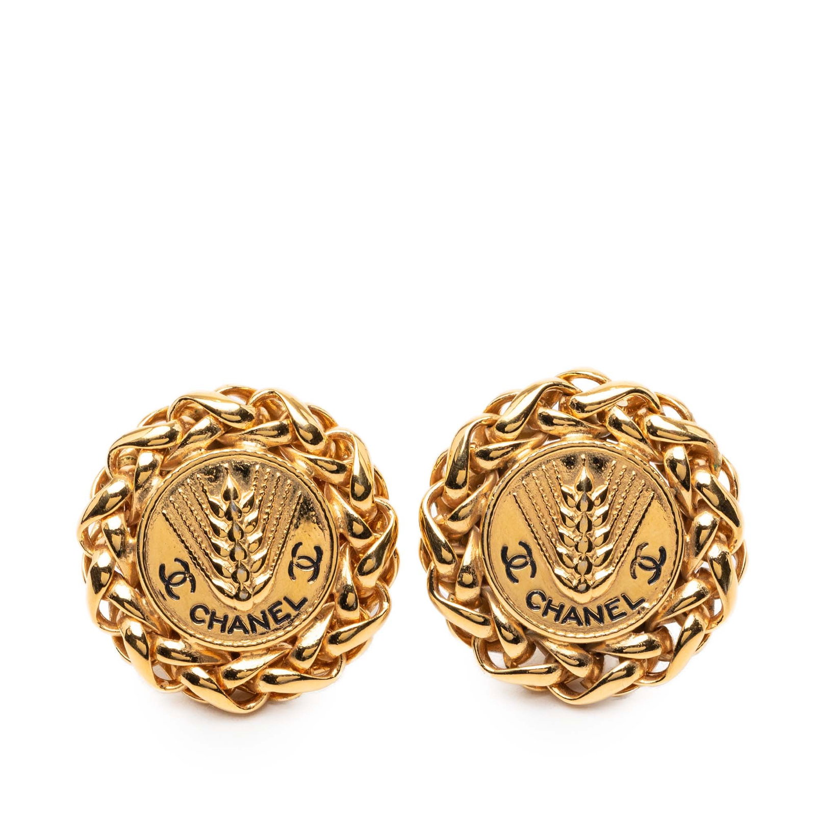 Chanel Wheat Motif Gold Tone Clip Earrings with CC Medallion: Chanel Wheat Motif Gold Tone Clip Earrings with CC Medallion These Chanel clip-on earrings feature a gold-tone metal construction with a wheat medallion design and CC logo. They are designed for pierc