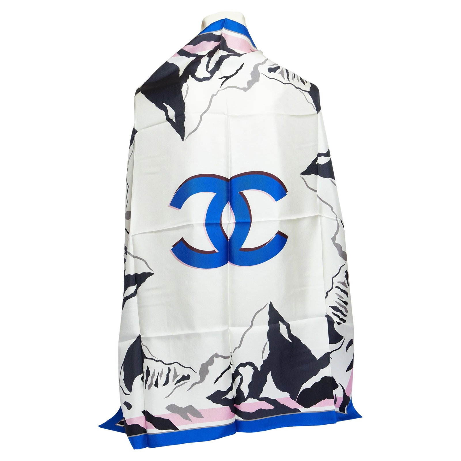 Chanel 36 in Silk Square Scarf Blue CC Logo: Chanel 36 in Silk Square Scarf Blue CC Logo This unused Chanel scarf is crafted from 100% silk and features a prominent blue CC logo at the center, surrounded by black mountain motifs reminiscent of t