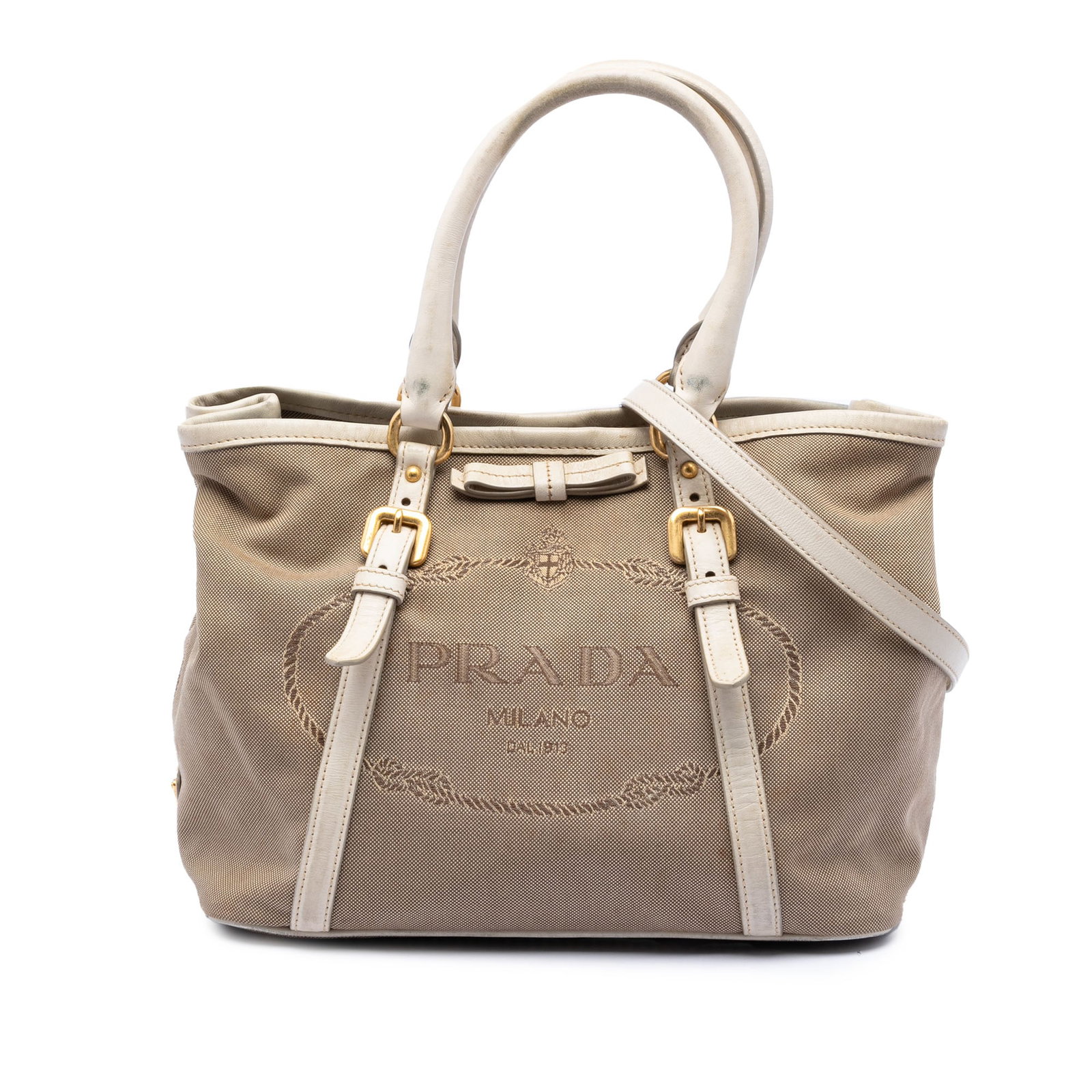 Prada Canapa Bow Canvas Satchel with Leather Trim: Prada Canapa Bow Canvas Satchel with Leather Trim Prada Canvas Canapa Logo Bow Satchel in beige fabric with leather trim. This satchel features rolled leather handles, a detachable and adjustable flat
