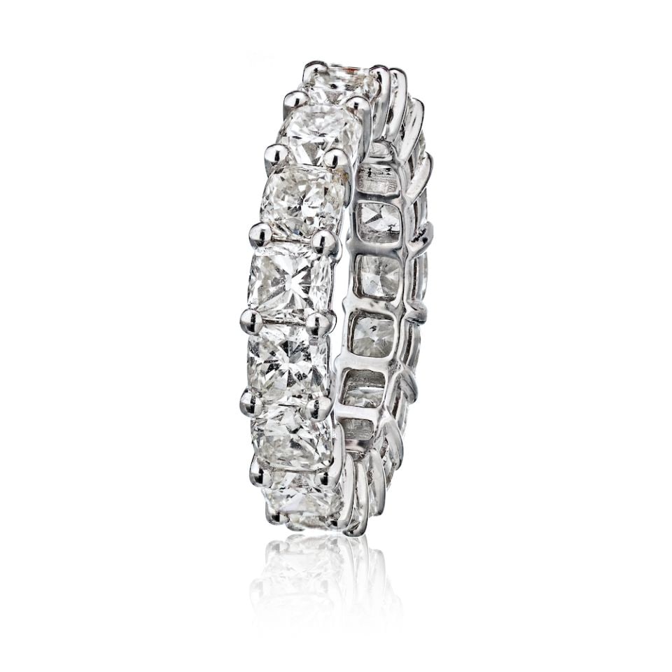 Platinum Eternity Band with 17 Cushion Cut Diamonds 6.00 cttw: Platinum Eternity Band with 17 Cushion Cut Diamonds 6.00 cttw This exquisite platinum eternity band features 17 hand-set cushion cut diamonds, each approximately 0.35 carats, totaling an impressive 6.