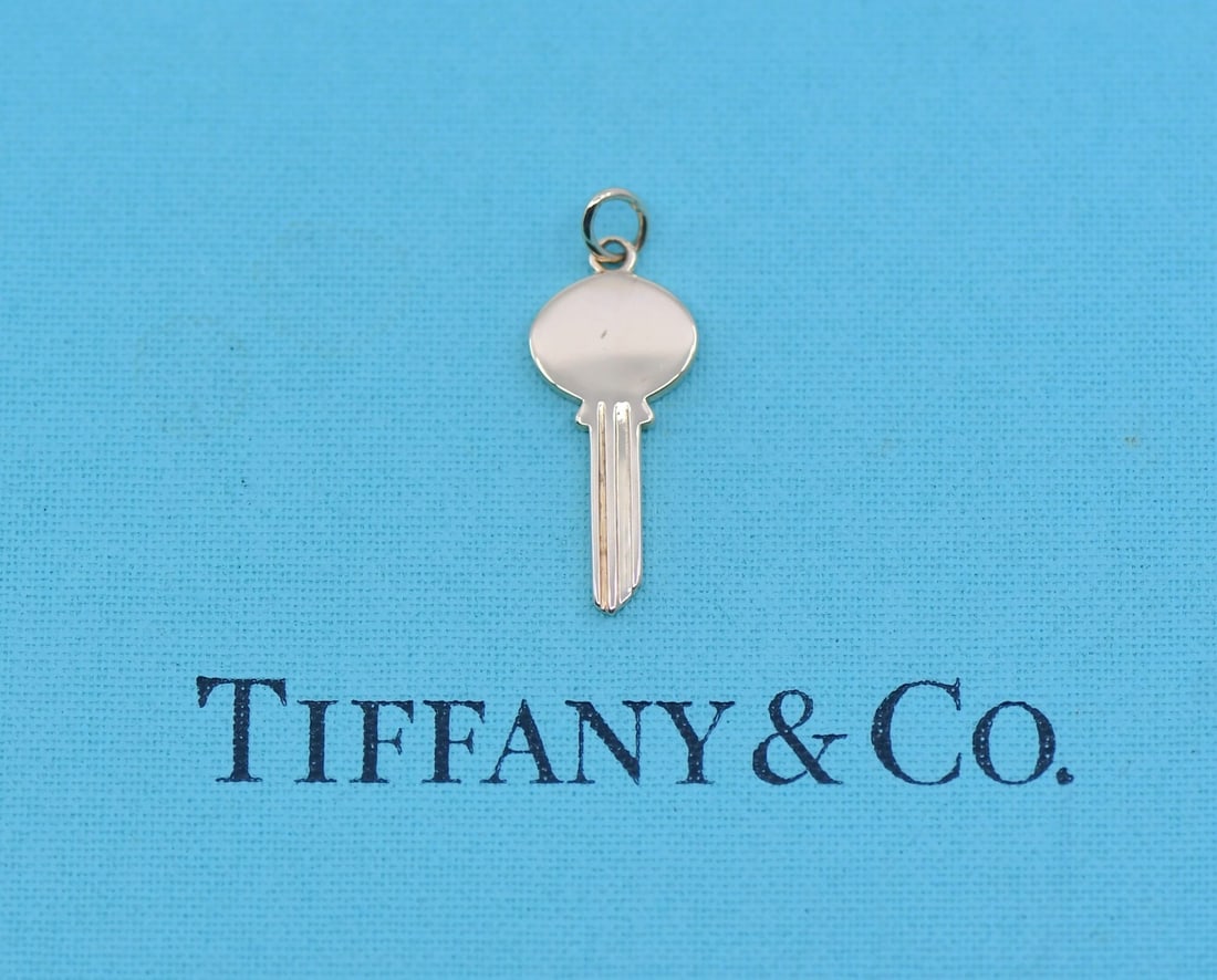 Tiffany & Co Tiffany Keys 18K Rose Gold Pendant 22mm: Tiffany & Co Tiffany Keys 18K Rose Gold Pendant 22mm Tiffany & Co. 18K rose gold key pendant from the Tiffany Keys collection. The pendant has no stone, was made in Italy, and measures 22 mm with a we