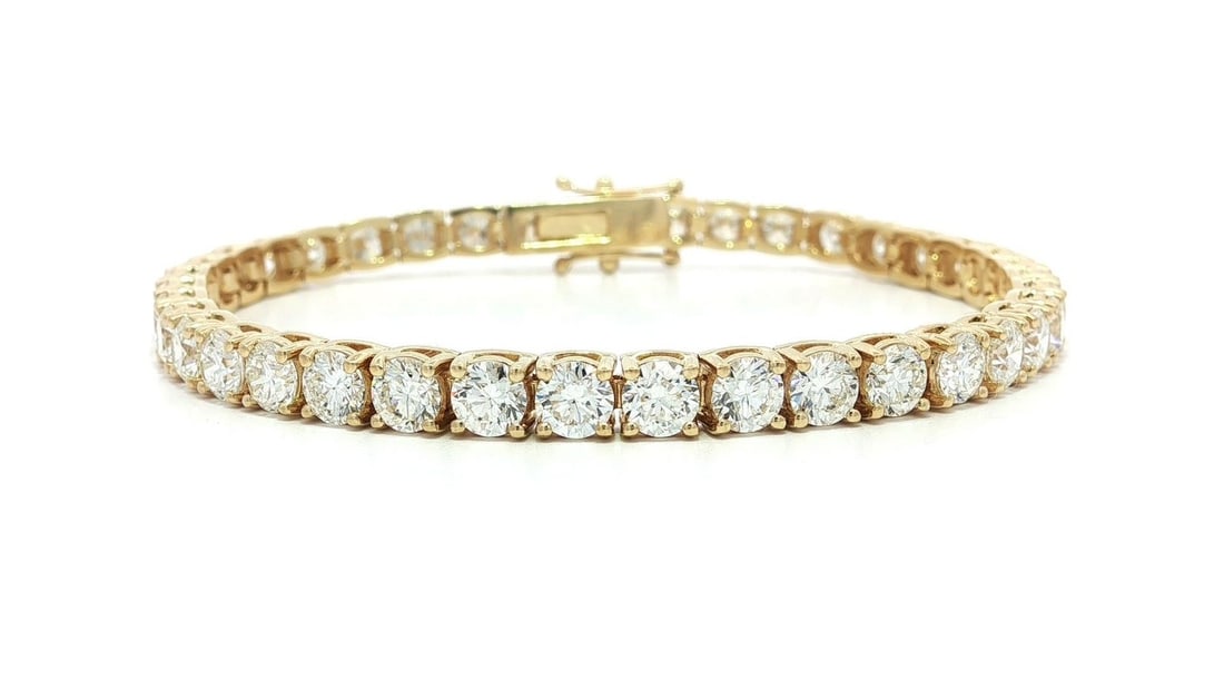 18k Yellow Gold 11.87ctw VS Round Diamond Tennis Bracelet: 18k Yellow Gold 11.87ctw VS Round Diamond Tennis Bracelet This stunning tennis bracelet features 39 natural genuine diamonds, each expertly crafted in a round brilliant cut and prong set for maximum b