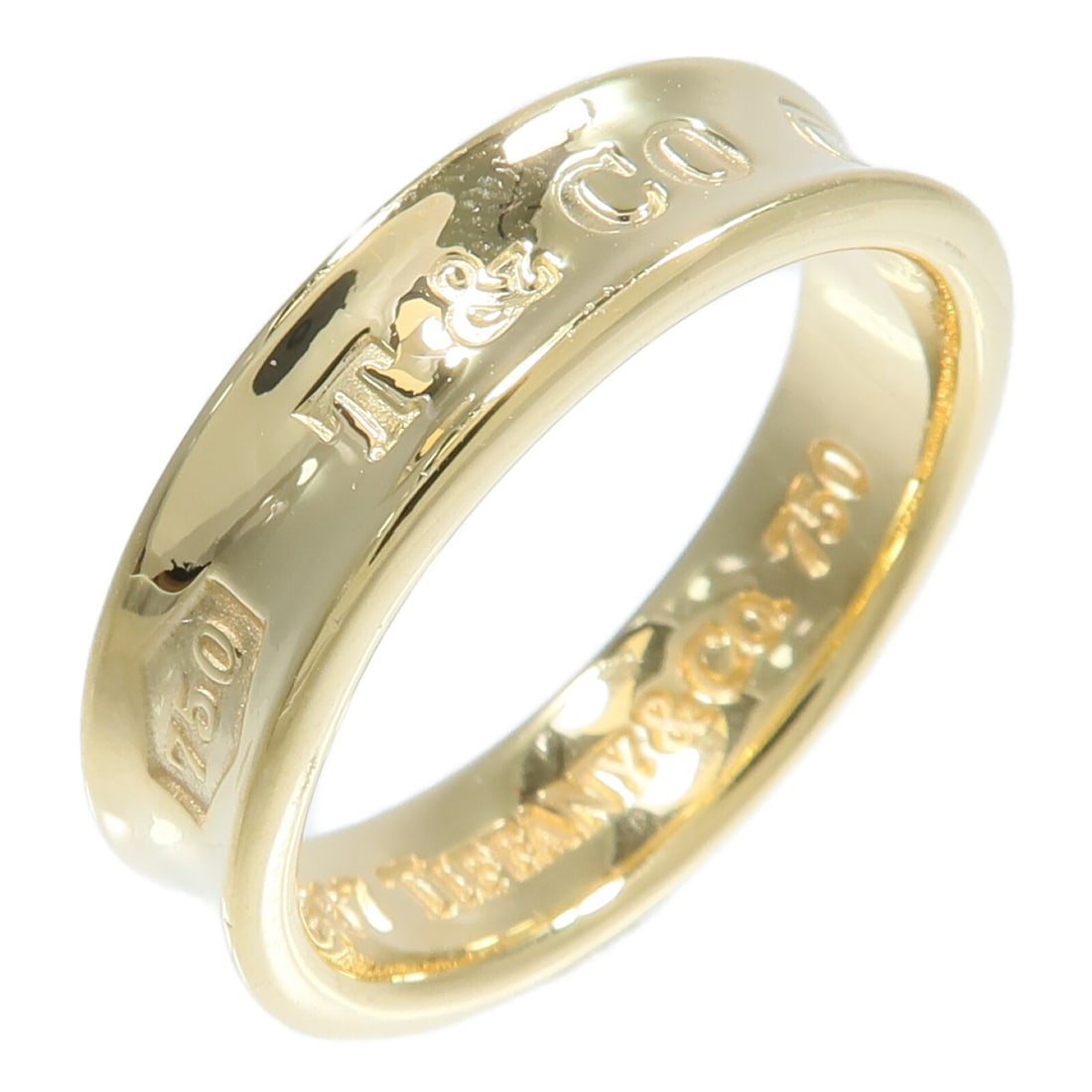 Tiffany Co 1837 18K Yellow Gold Ring Size 9.75: Tiffany Co 1837 18K Yellow Gold Ring Size 9.75 Tiffany & Co. 1837 ring in 18K yellow gold, sized US 9.75. The ring is described as having no stone and a 6 mm width. It is listed in reasonable worn con
