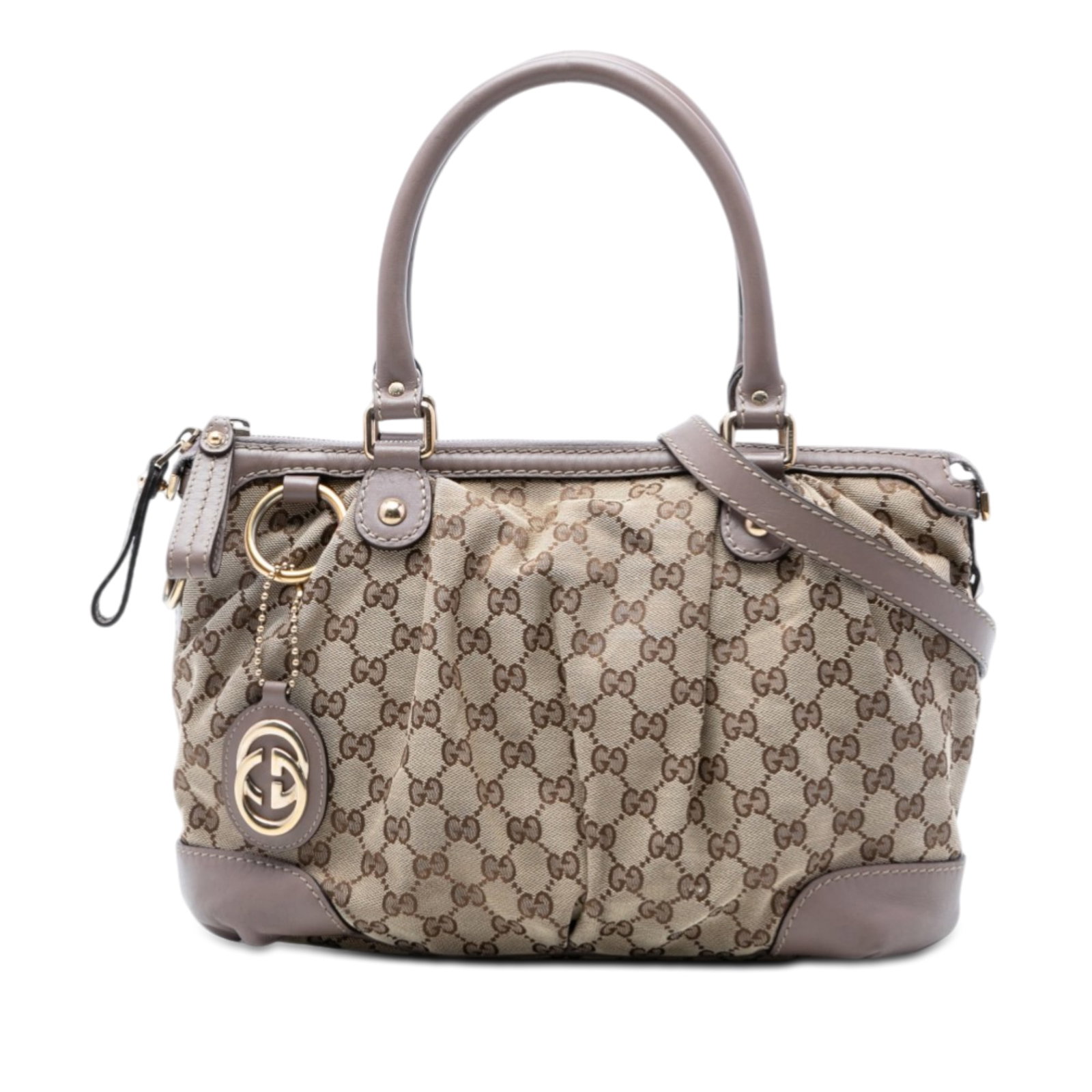 Gucci GG Canvas Beige Sukey Leather Trim Satchel: Gucci GG Canvas Beige Sukey Leather Trim Satchel This Gucci GG Canvas Sukey Satchel features a beige fabric body with leather trim, rolled leather handles, a top zip closure, and interior zip and slip