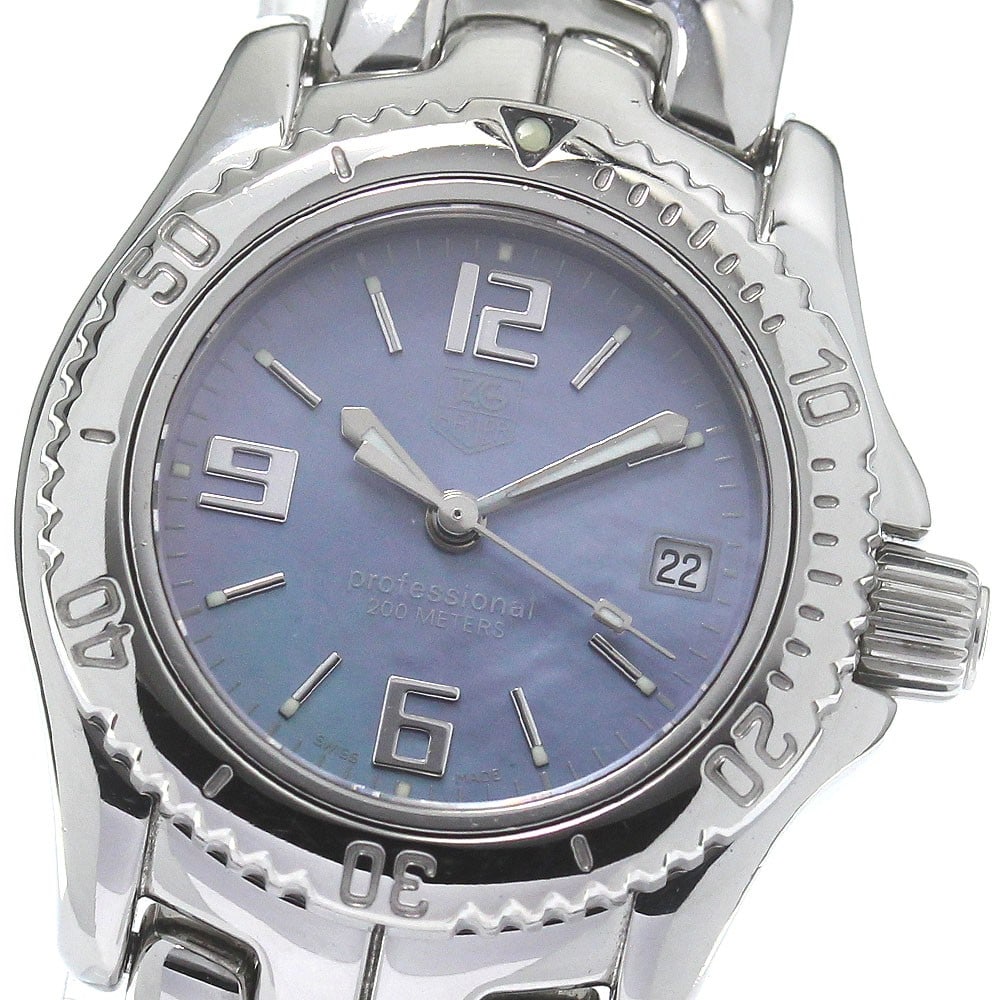 TAG Heuer Professional Quartz Date Ladies Steel Watch WT141B: TAG Heuer Professional Quartz Date Ladies Steel Watch WT141B This TAG HEUER Professional Date Quartz Women's Watch, model WT141B, features a blue shell dial and stainless steel case and bracelet. The 