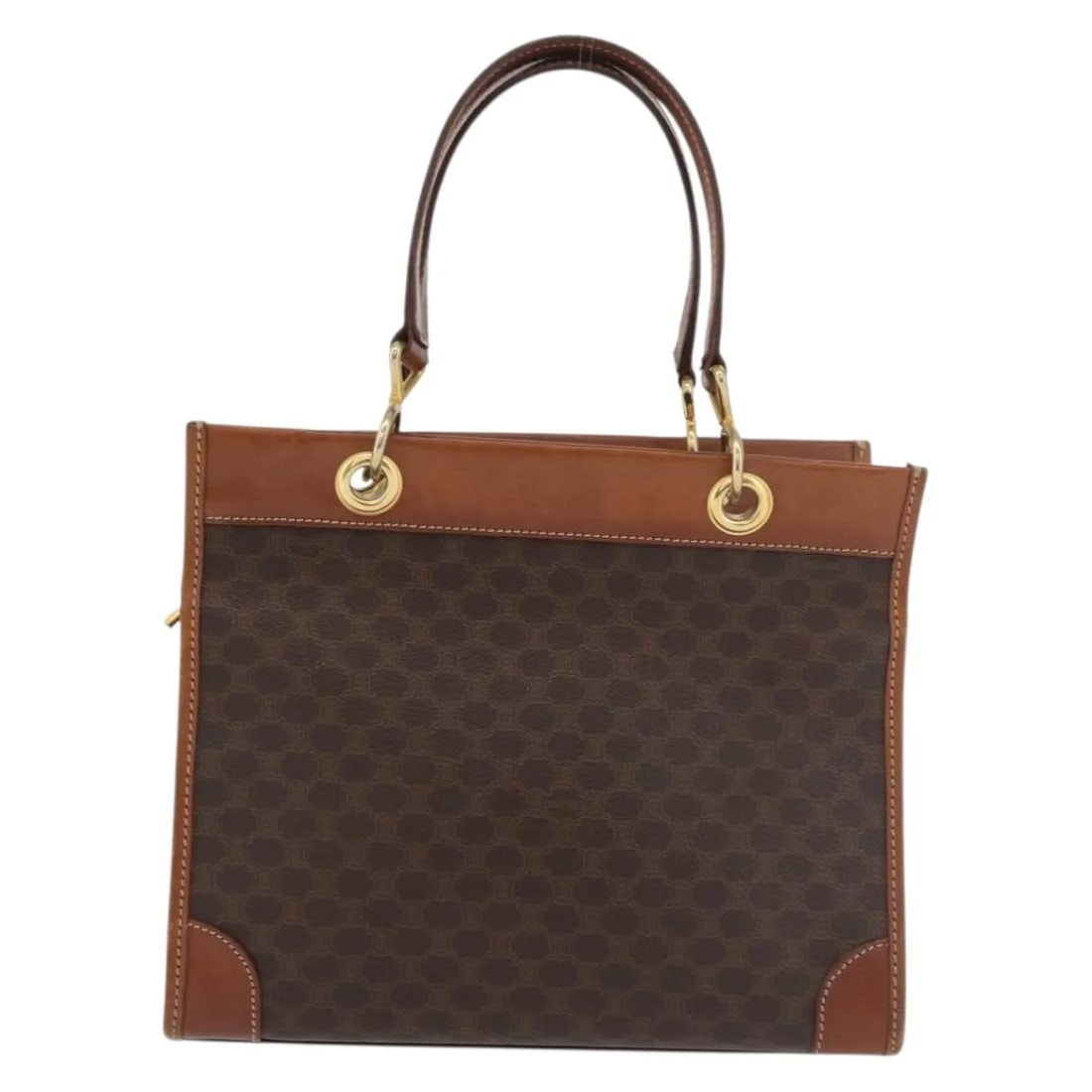 Celine Vintage Macadam Brown Canvas Tote: Celine Vintage Macadam Brown Canvas Tote This Celine Vintage Macadam Tote bag is crafted from brown canvas with leather accents. Designed for women, it features a spacious interior and a classic silho