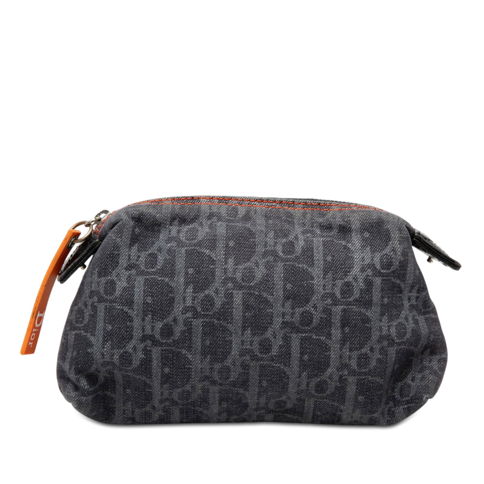 Dior Denim Diorissimo Trotter Cosmetic Pouch: Dior Denim Diorissimo Trotter Cosmetic Pouch This Diorissimo Trotter Denim Flight Cosmetic Pouch showcases a blue denim fabric body and is designed with a top zip closure. The pouch is crafted in Spai