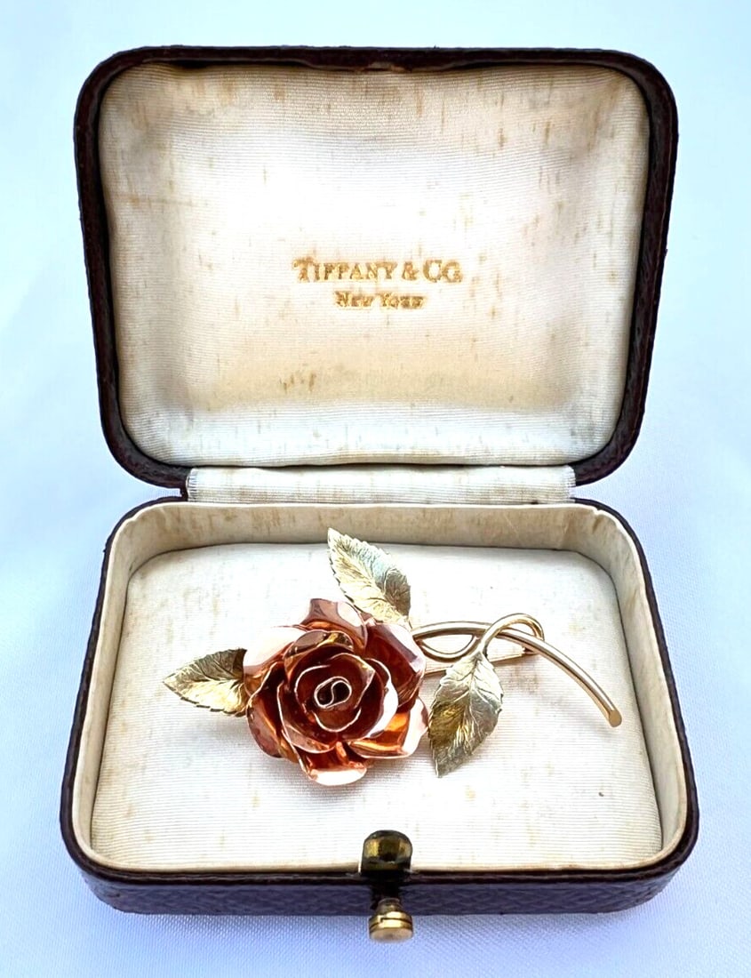 Tiffany & Co 14K Rose Yellow Gold Flower Brooch with Original Box: Tiffany & Co 14K Rose Yellow Gold Flower Brooch with Original Box This exquisite early 1900's brooch from Tiffany & Co. showcases a stunning floral design crafted from 14K rose and yellow gold. The pi