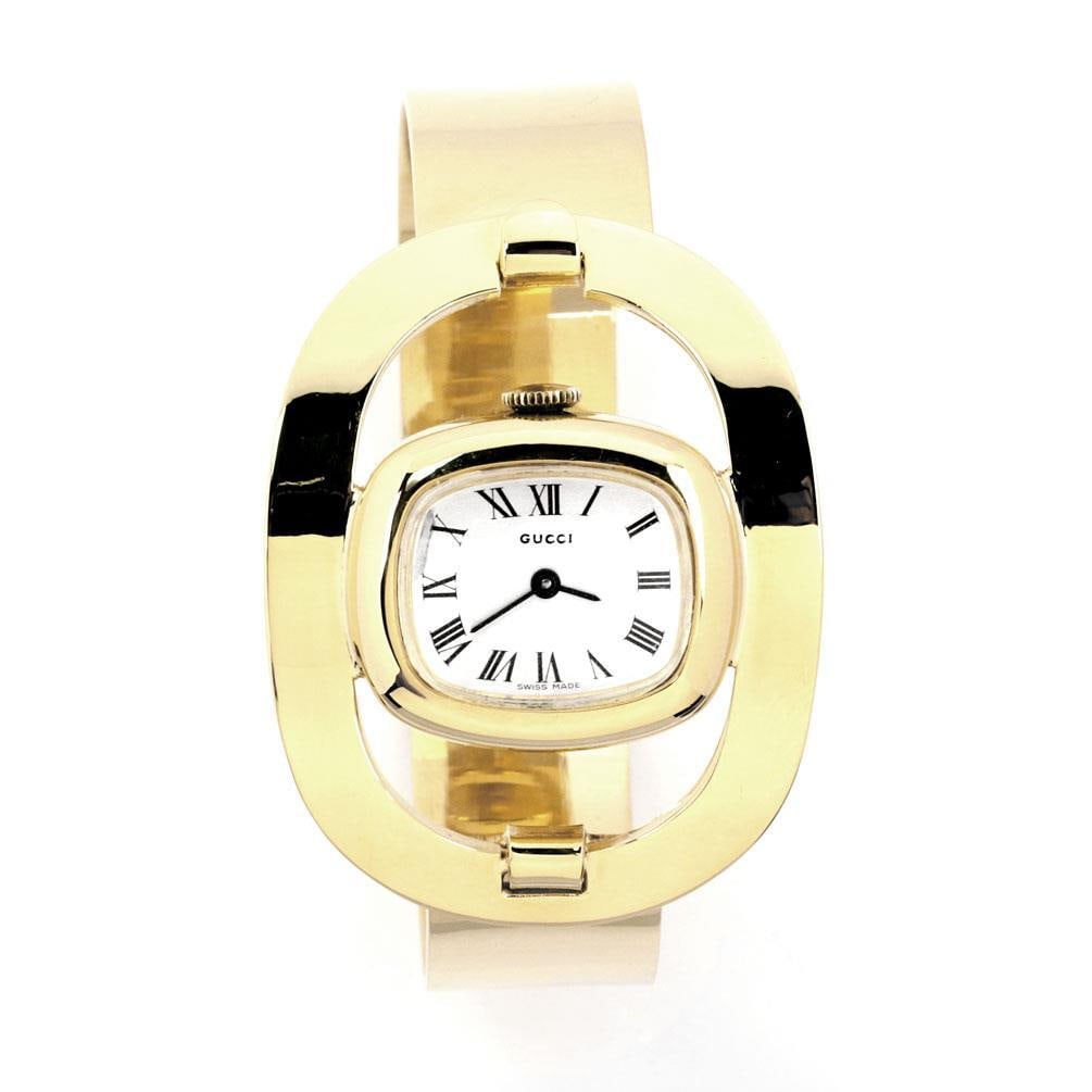 Gucci Vintage 18k Yellow Gold Horse Stirrup Motif Ladies Watch: Gucci Vintage 18k Yellow Gold Horse Stirrup Motif Ladies Watch This exquisite Gucci vintage wrist watch features a unique Horse stirrup motif designed specifically for ladies. Crafted from authentic 1