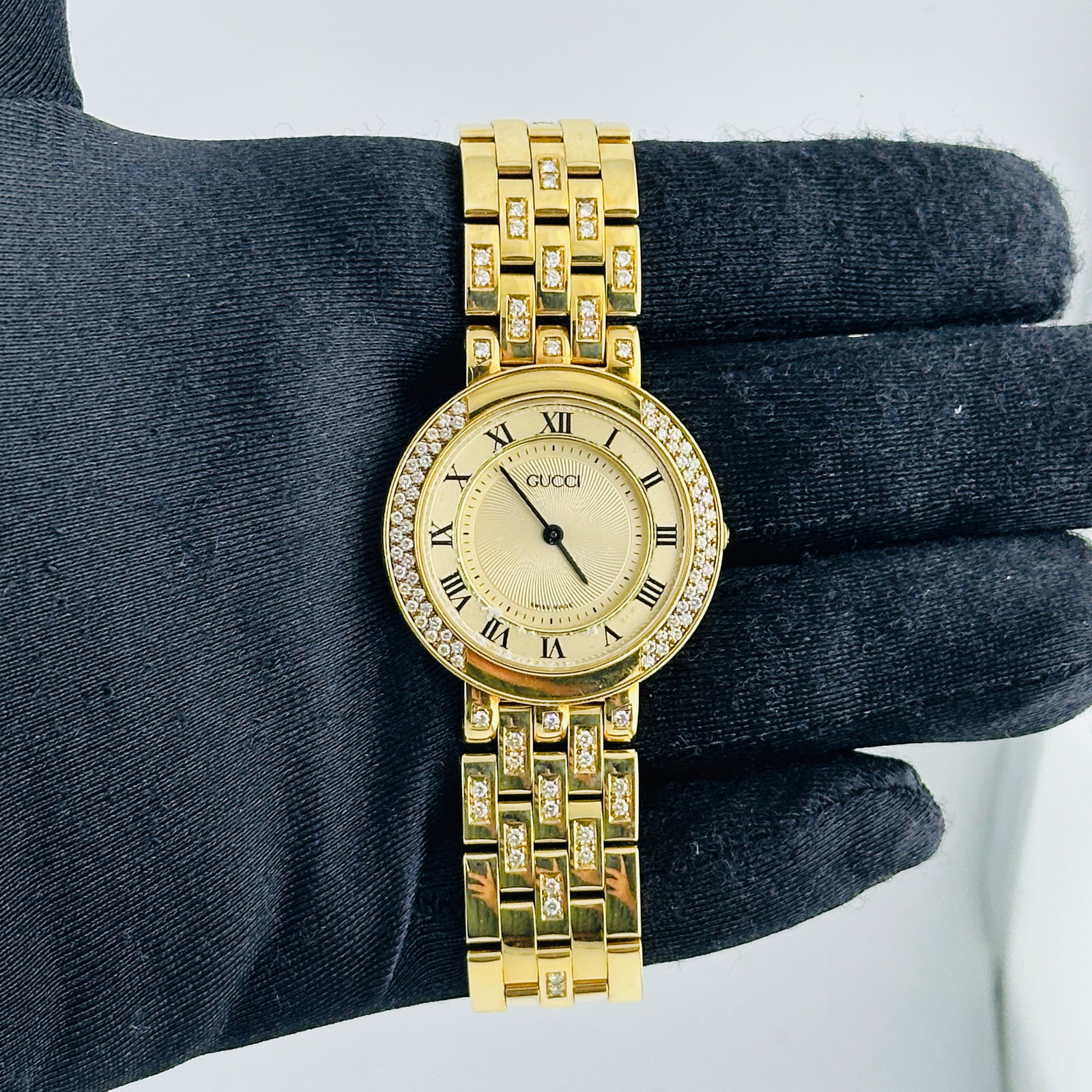 Ref 751M 33mm Gucci Watch Yellow Gold Tone Dial: Ref 751M 33mm Gucci Watch Yellow Gold Tone Dial This is a pre-owned Gucci wristwatch featuring a gold-tone dial with visible spots. The watch has a 33mm case and is crafted from yellow gold-tone metal