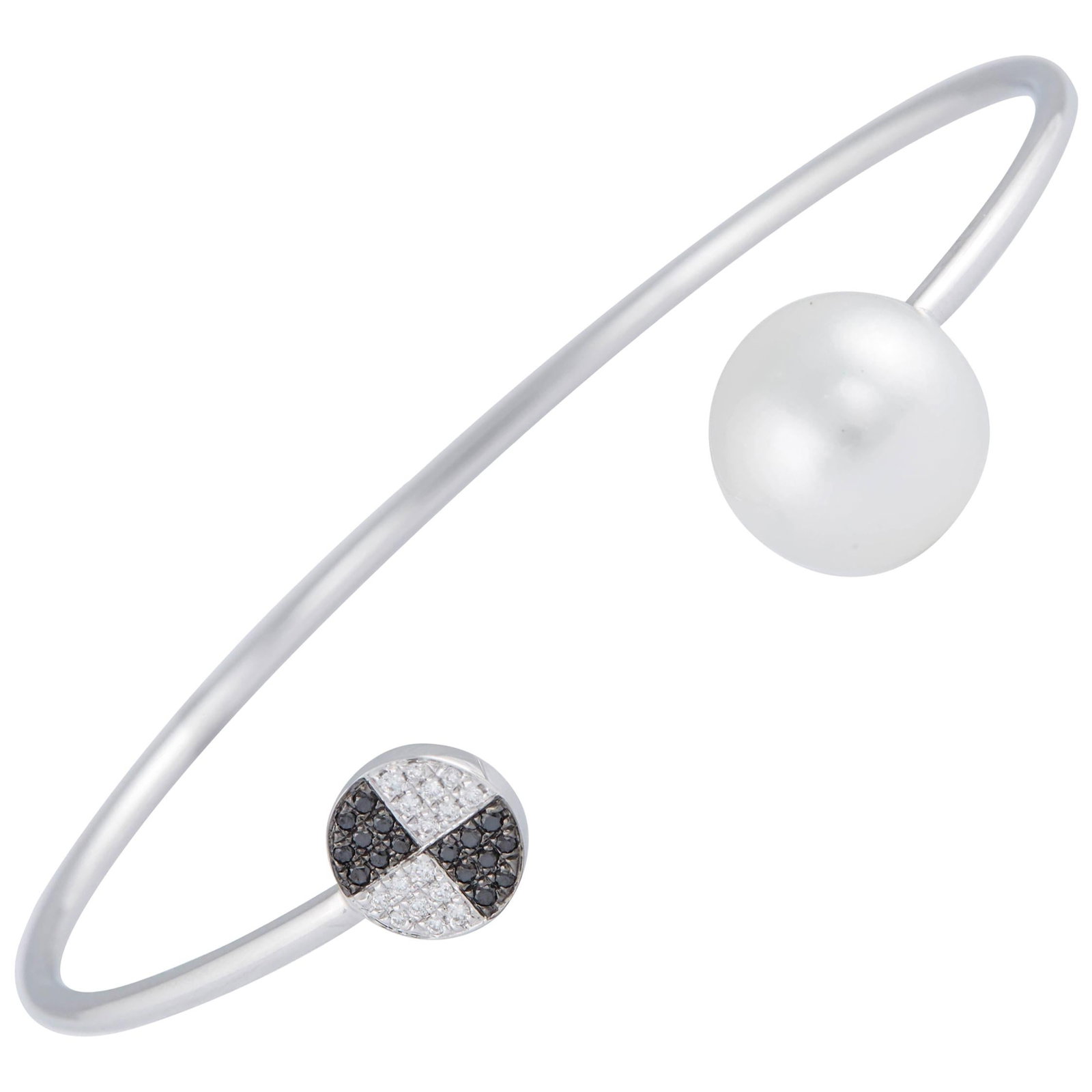 Harbor Diamonds Black White Diamond South Sea Pearl Bangle 18K Gold: Harbor Diamonds Black White Diamond South Sea Pearl Bangle 18K Gold This exquisite bangle features a stunning combination of black and white diamonds set in luxurious 18k white gold. The elegant desig