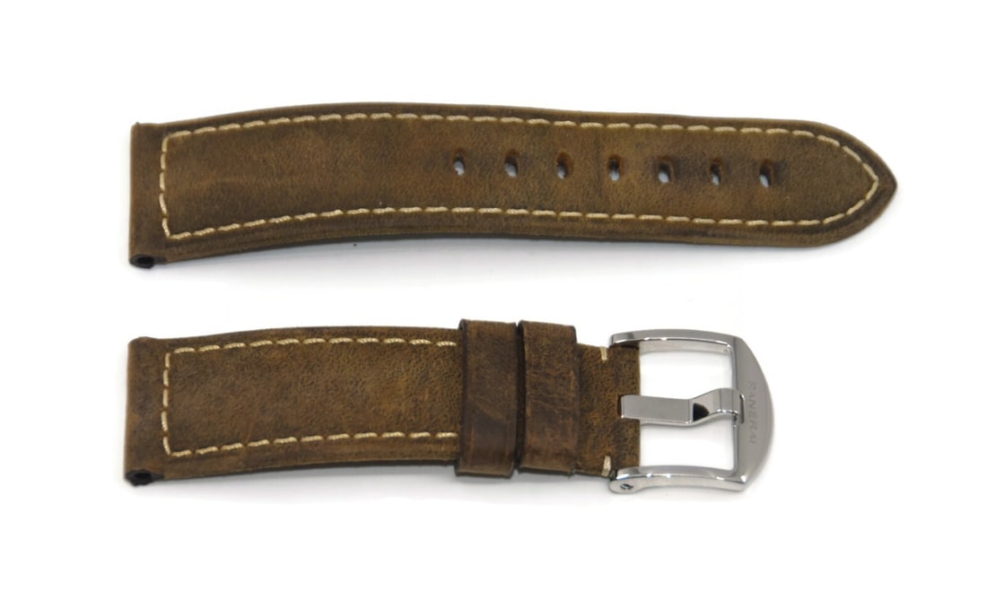 Authentic Panerai Brown Leather 22mm Two-Piece Watch Strap: Authentic Panerai Brown Leather 22mm Two-Piece Watch Strap Enhance your timepiece with this Panerai Brown Leather Strap, designed for both style and comfort. This two-piece wristwatch band features a 