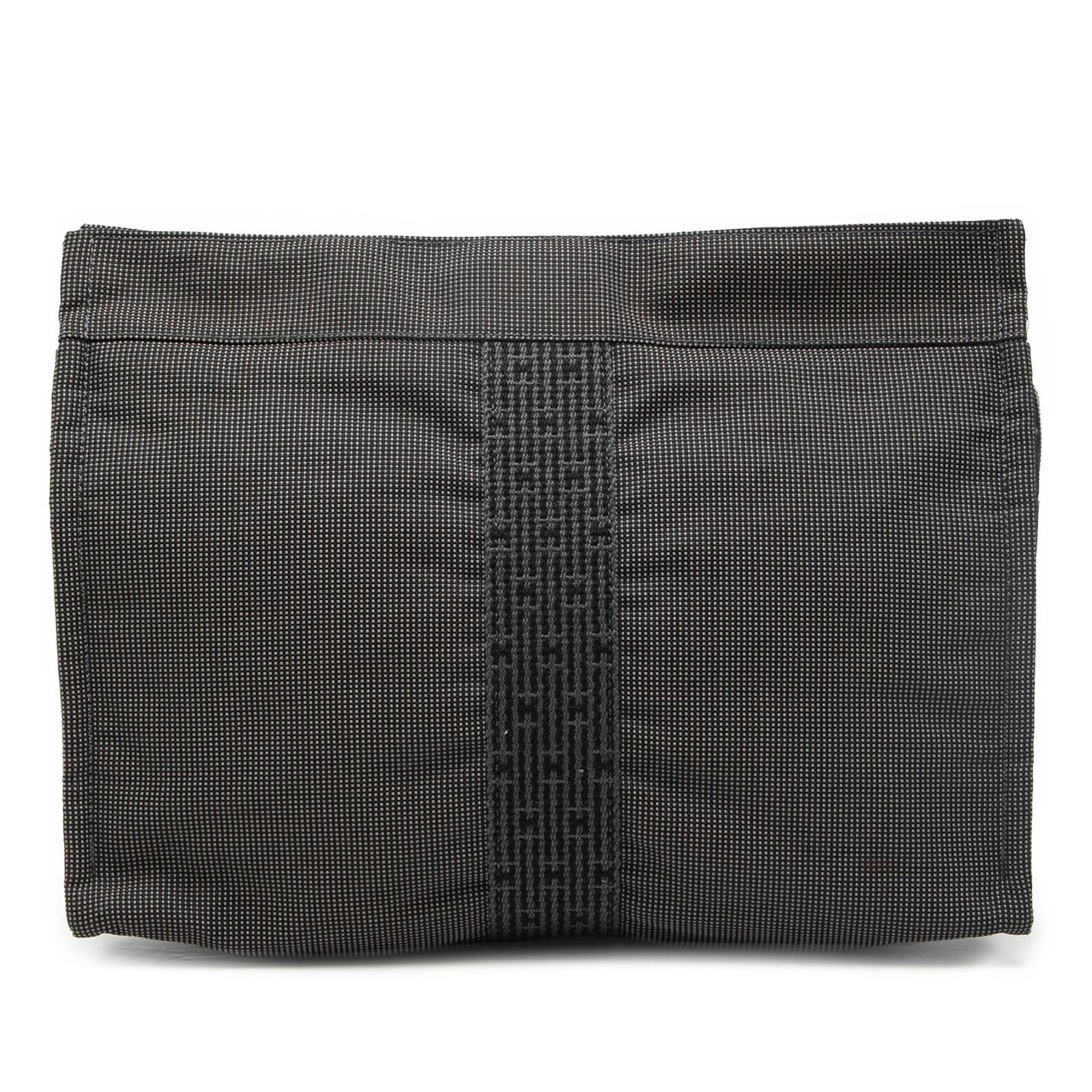Hermes Herline Gray Canvas Zip Clutch Bag: Hermes Herline Gray Canvas Zip Clutch Bag Hermes Herline clutch crafted in canvas with a top zip closure and interior slip pockets. The piece shows visible wear to the exterior, including the front, b