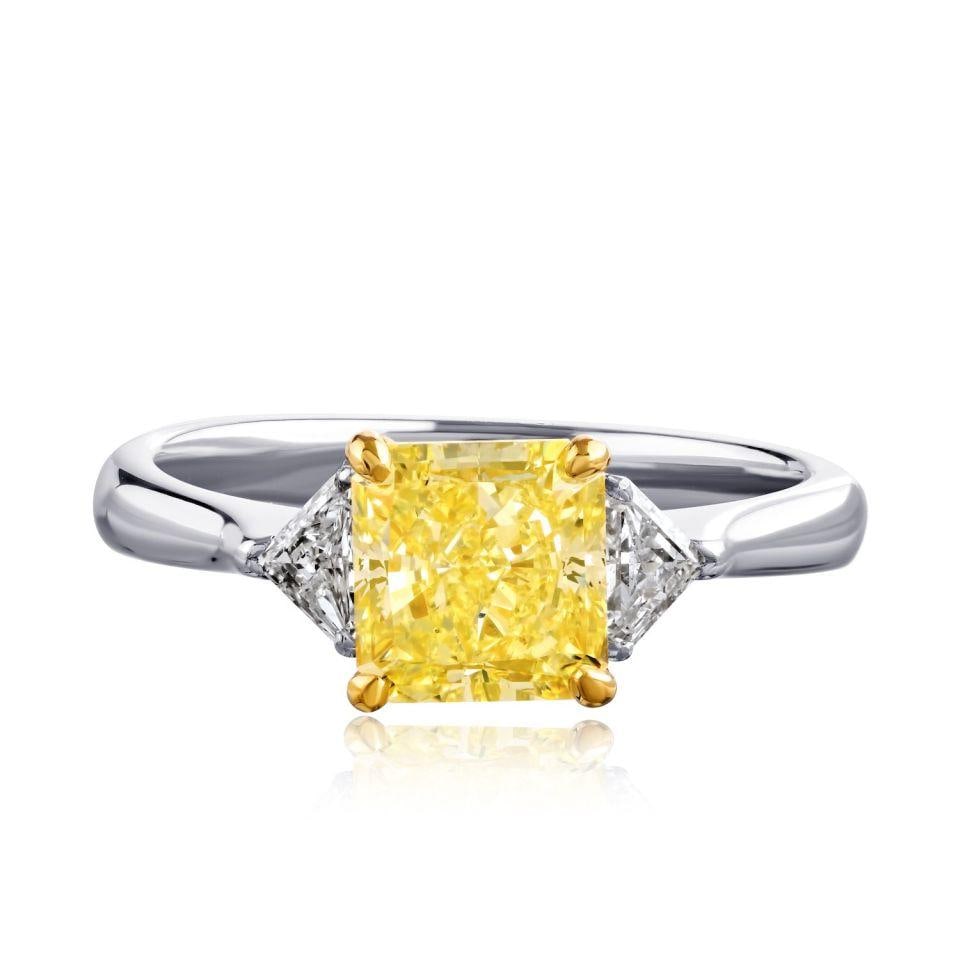 Platinum 18K Yellow Gold Three Stone Ring 2.05ct Fancy Yellow Radiant Cut GIA: Platinum 18K Yellow Gold Three Stone Ring 2.05ct Fancy Yellow Radiant Cut GIA Pre-owned three-stone engagement ring featuring a GIA-certified 2.05 ct Fancy Yellow radiant cut center diamond with shiel