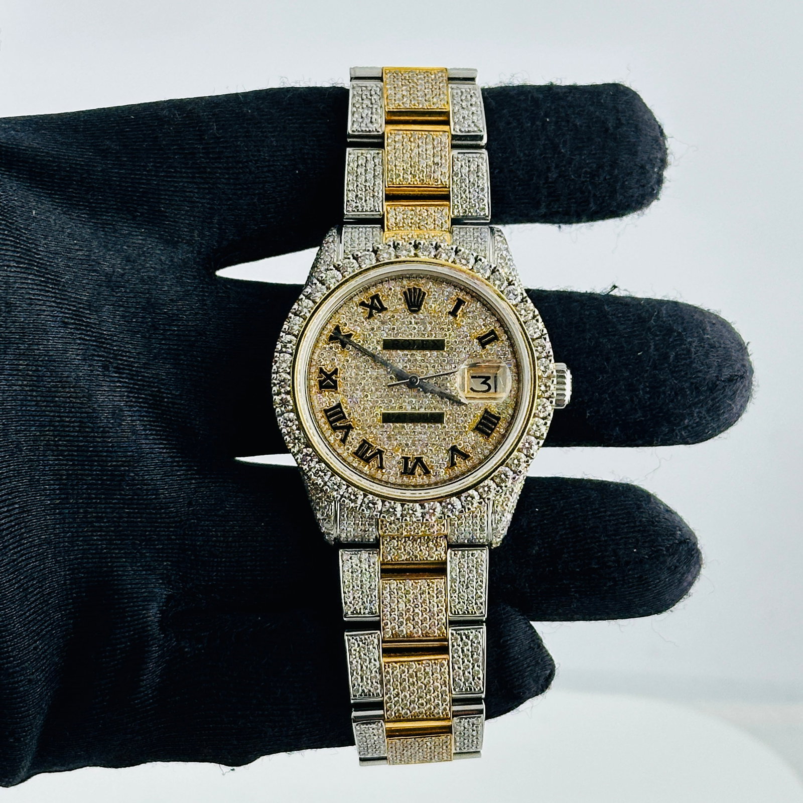 Mens Rolex Datejust 1603 Diamond Roman Dial Diamond Bezel Aftermarket Oyster Bracelet: Mens Rolex Datejust 1603 Diamond Roman Dial Diamond Bezel Aftermarket Oyster Bracelet This men's Rolex Datejust watch features a diamond Roman numeral dial and a diamond bezel. It is equipped with an 