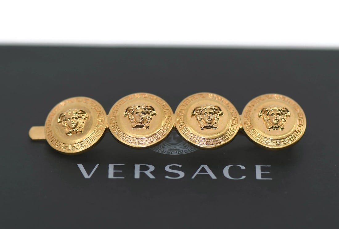 Gold Tone Hair Pin by Versace 65mm Italian Accessory: Gold Tone Hair Pin by Versace 65mm Italian Accessory This Versace gold plated hair pin is designed for women and features a stylish gold finish. Made in Italy, it measures 65mm in length and weighs 10