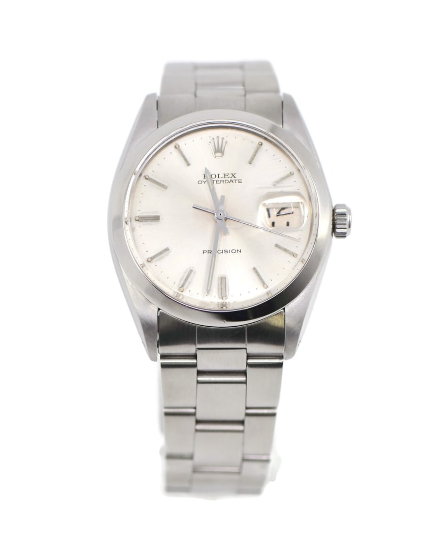Rolex Oyster Date 6694 Stainless Steel Watch with Box: Rolex Oyster Date 6694 Stainless Steel Watch with Box This exquisite Rolex Oyster Date wristwatch, model 6694, embodies the elegance and precision synonymous with the Rolex brand. Crafted from high-qu