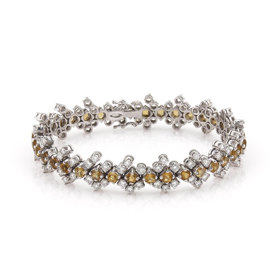 Estate 18k White Gold Floral Link Bracelet with Diamonds and Citrine: Estate 18k White Gold Floral Link Bracelet with Diamonds and Citrine This stunning estate bracelet is expertly crafted from 18k white gold, featuring a polished finish that highlights its exquisite de