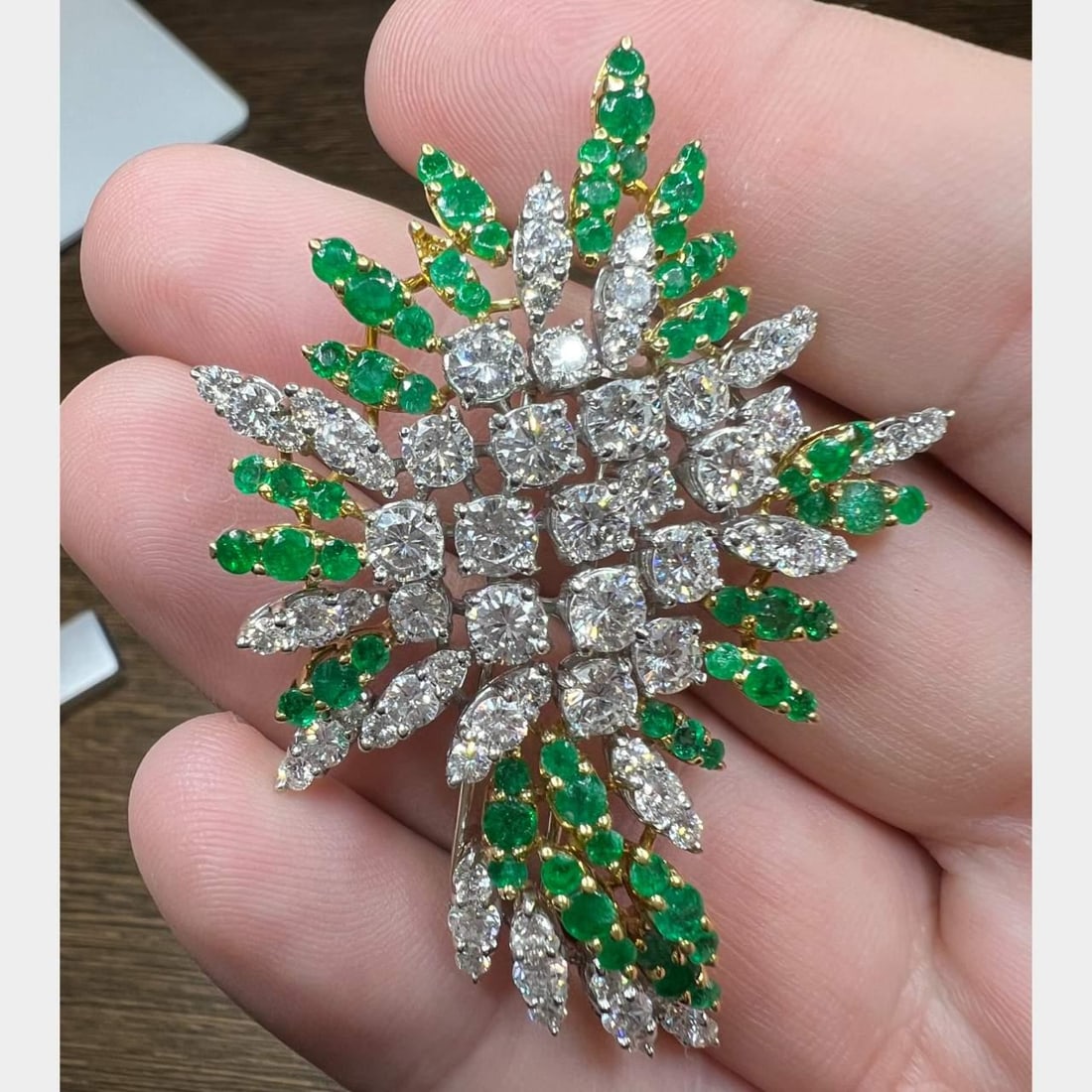 18K Yellow Gold Platinum Diamond Emerald Brooch 4.75 Ct Diamonds 66 Emeralds: 18K Yellow Gold Platinum Diamond Emerald Brooch 4.75 Ct Diamonds 66 Emeralds This exquisite brooch is crafted from 18K yellow gold and platinum, showcasing a stunning arrangement of diamonds and emera