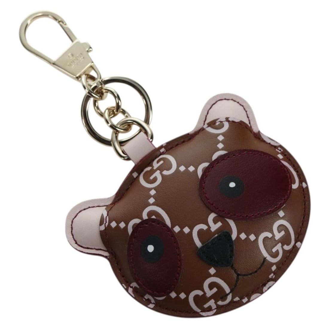 Gucci leather panda bag charm brown gold with dust bag and box: Gucci leather panda bag charm brown gold with dust bag and box This GUCCI GG embossed leather panda bag charm features a stylish brown and gold color scheme and is crafted from high-quality leather. D