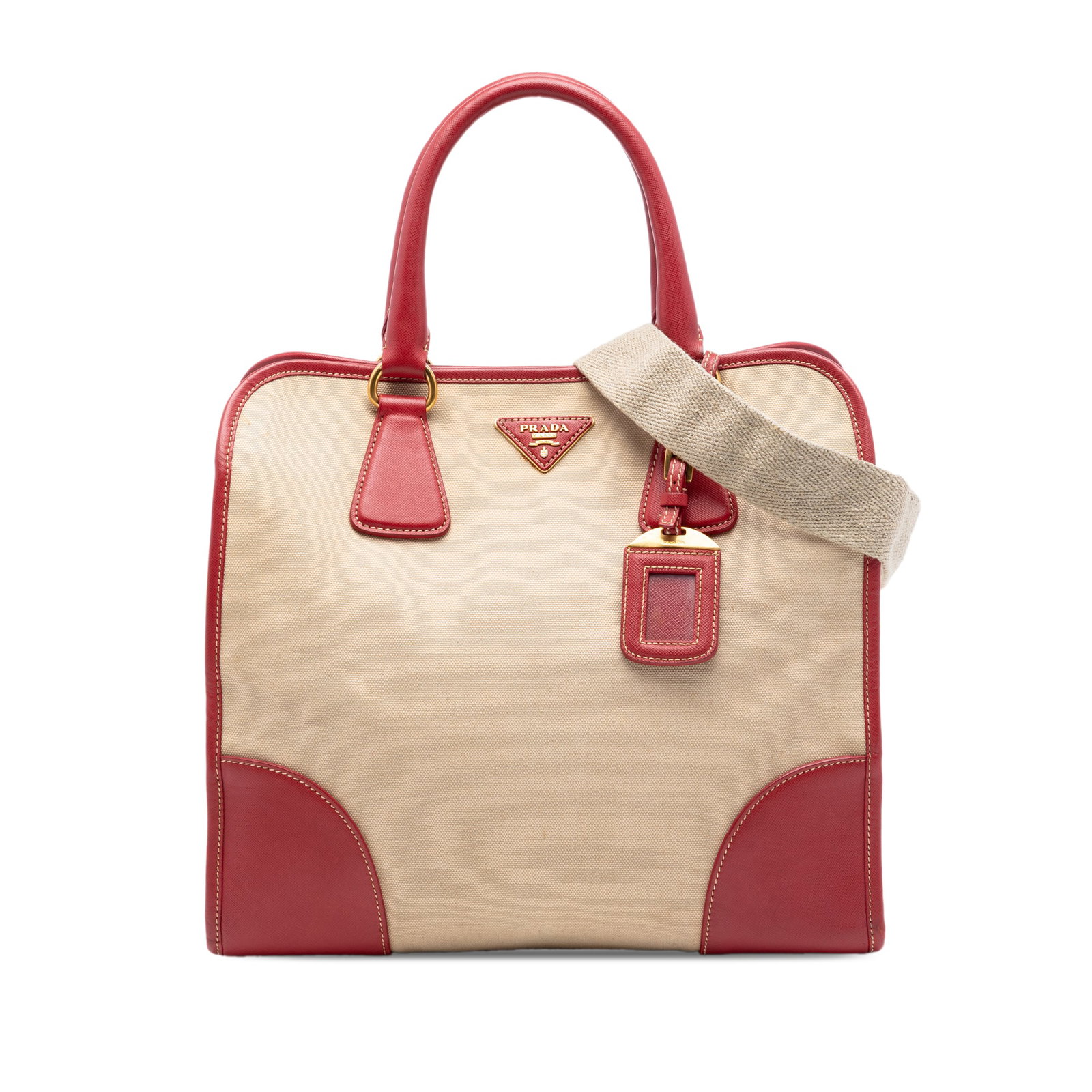 Prada Canapa beige canvas satchel with saffiano trim: Prada Canapa beige canvas satchel with saffiano trim This Prada Saffiano Trimmed Canvas Canapa Satchel features a beige canvas body accented with saffiano leather trim, rolled leather handles, and a d