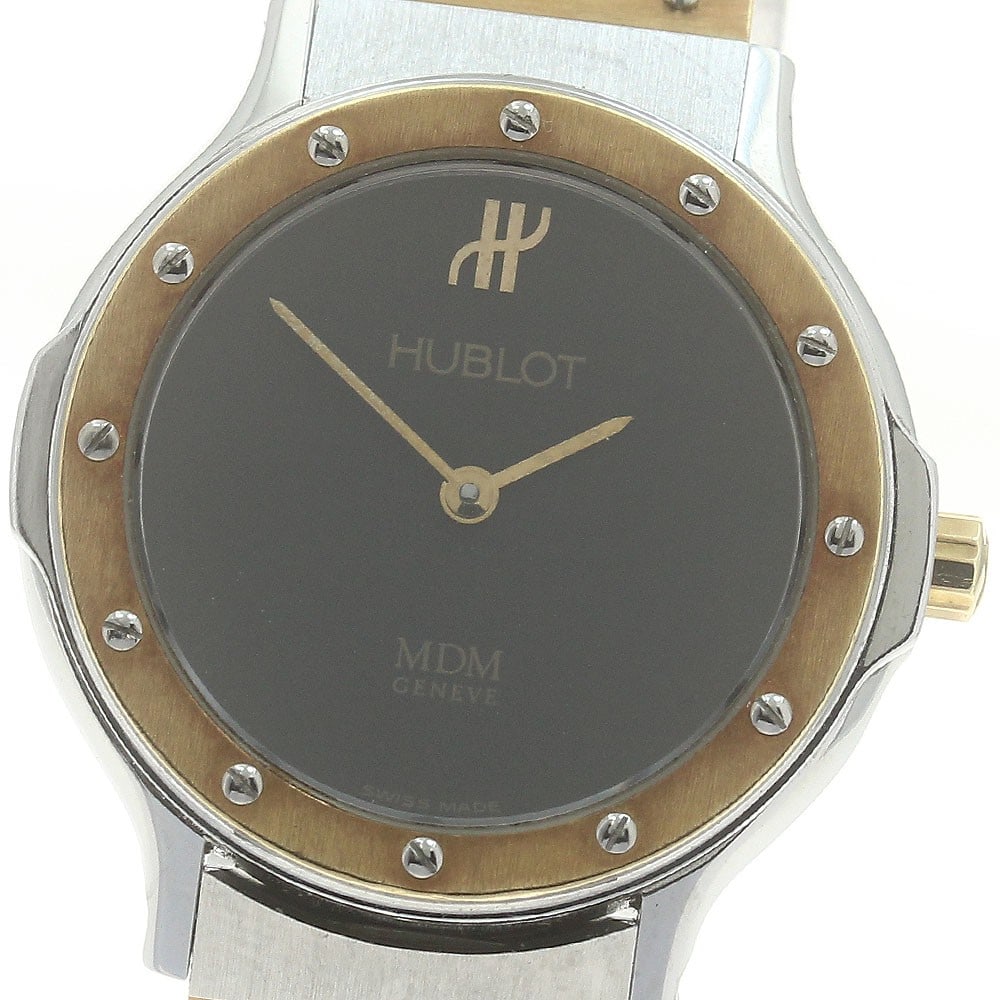 Women's Hublot MDM 1280.100.2 Quartz Wristwatch: Women's Hublot MDM 1280.100.2 Quartz Wristwatch Hublot MDM women's wristwatch, reference 1280.100.2, with a quartz movement and black dial. This pre-owned watch is made in Switzerland and is offered a