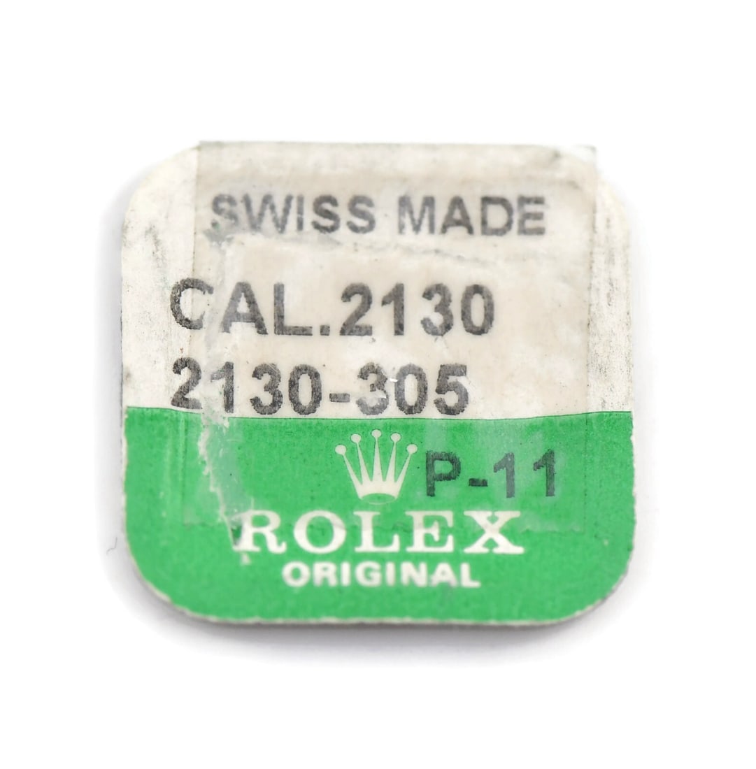 Rolex Cal 2130 2130-305 Movement Wheel Part: Rolex Cal 2130 2130-305 Movement Wheel Part This is a pre-owned movement part from Rolex, specifically the Cal 2130 2130-305 Wheel designed for compatibility with the Rolex Cal 2130 model. It is an es