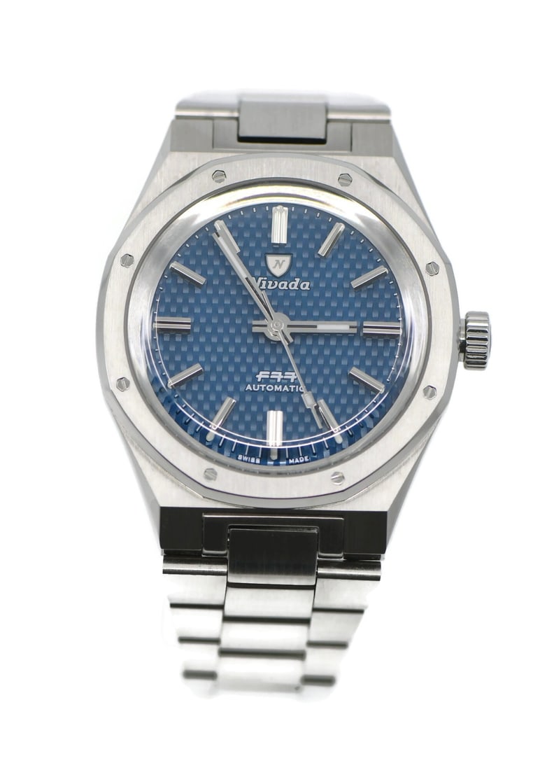 Nivada Grenchen F77 men's stainless steel wristwatch with box papers: Nivada Grenchen F77 men's stainless steel wristwatch with box papers Pre-owned Nivada Grenchen F77 wristwatch in stainless steel, designed for men with an analog display. It comes with the original bo