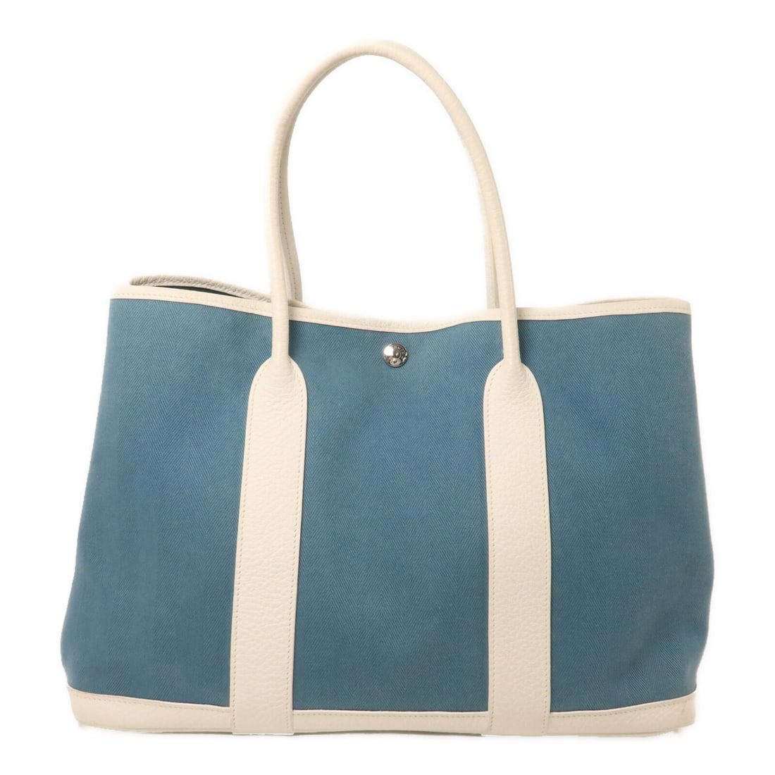 Hermes Garden Party PM canvas handbag blue and white: Hermes Garden Party PM canvas handbag blue and white Hermes PHW Garden Party PM handbag in canvas with a blue and white colorway. The bag is identified as model T/Blue and features a hook button closu