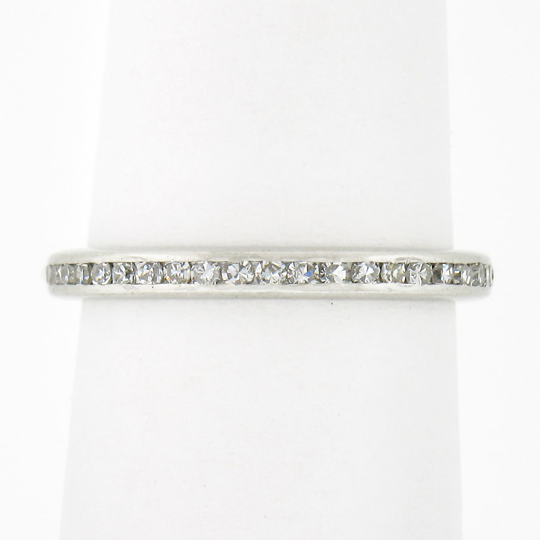 Antique Art Deco Platinum Eternity Wedding Band with 1.00ctw Diamonds: Antique Art Deco Platinum Eternity Wedding Band with 1.00ctw Diamonds This exquisite antique Art Deco wedding band ring is crafted from solid .900 platinum and features a stunning channel set of 43 ol