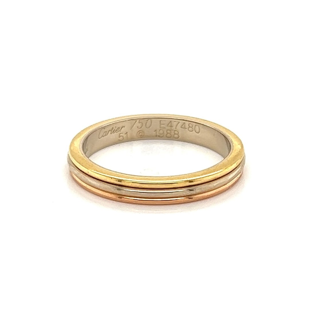 Cartier Tri-Color 18k Gold Ring Band with Certificate Size 51 US 5.5: Cartier Tri-Color 18k Gold Ring Band with Certificate Size 51 US 5.5 A pre-owned Cartier tri-color band ring crafted in 18k yellow, white, and rose gold. The slim polished band has a timeless design a