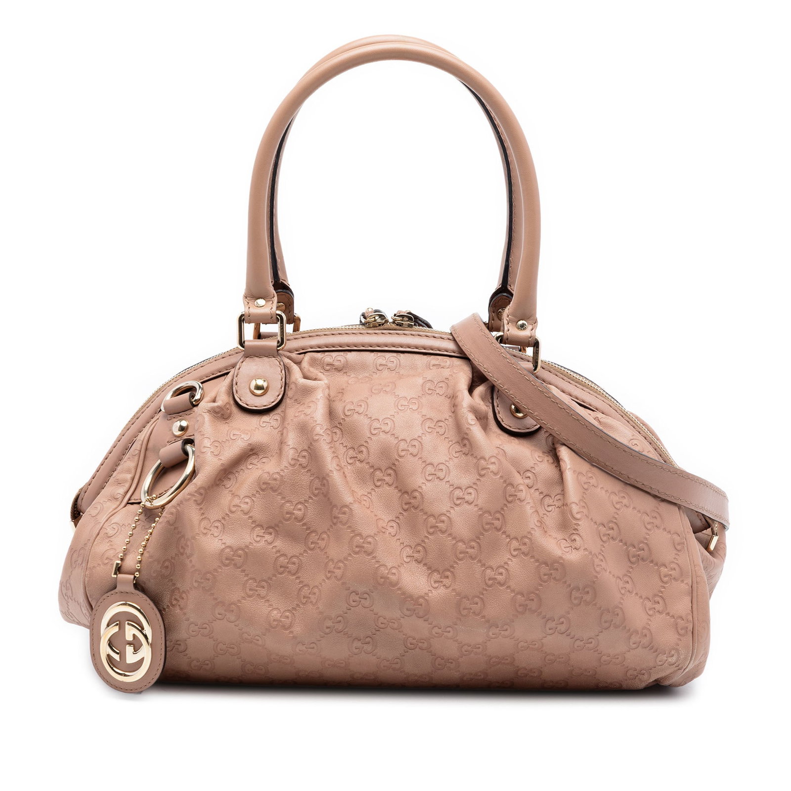 Gucci Guccissima pink leather Sukey satchel: Gucci Guccissima pink leather Sukey satchel The Guccissima Sukey Satchel showcases a pink embossed leather body with rolled leather handles and a detachable flat leather strap. It features a top zip c
