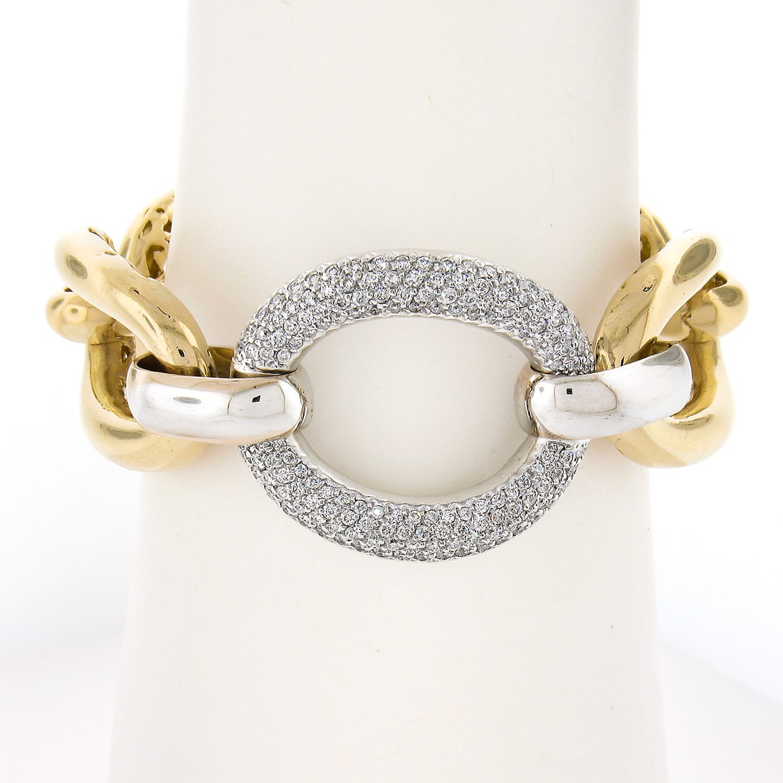 14K Two Tone Gold Open Oval Link Bracelet with 2.0ctw Pave Diamonds: 14K Two Tone Gold Open Oval Link Bracelet with 2.0ctw Pave Diamonds This exquisite bracelet features a stunning design composed of solid 14K two-tone gold, showcasing large open oval links and a capti