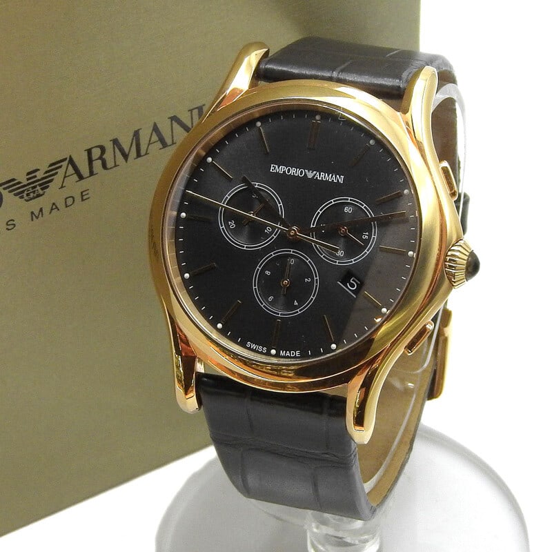 EMPORIO ARMANI ARS4003 Black Gold Quartz Wristwatch with Box: EMPORIO ARMANI ARS4003 Black Gold Quartz Wristwatch with Box This EMPORIO ARMANI quartz wristwatch ARS4003 features a stylish black and gold design that is perfect for any occasion. The watch is power